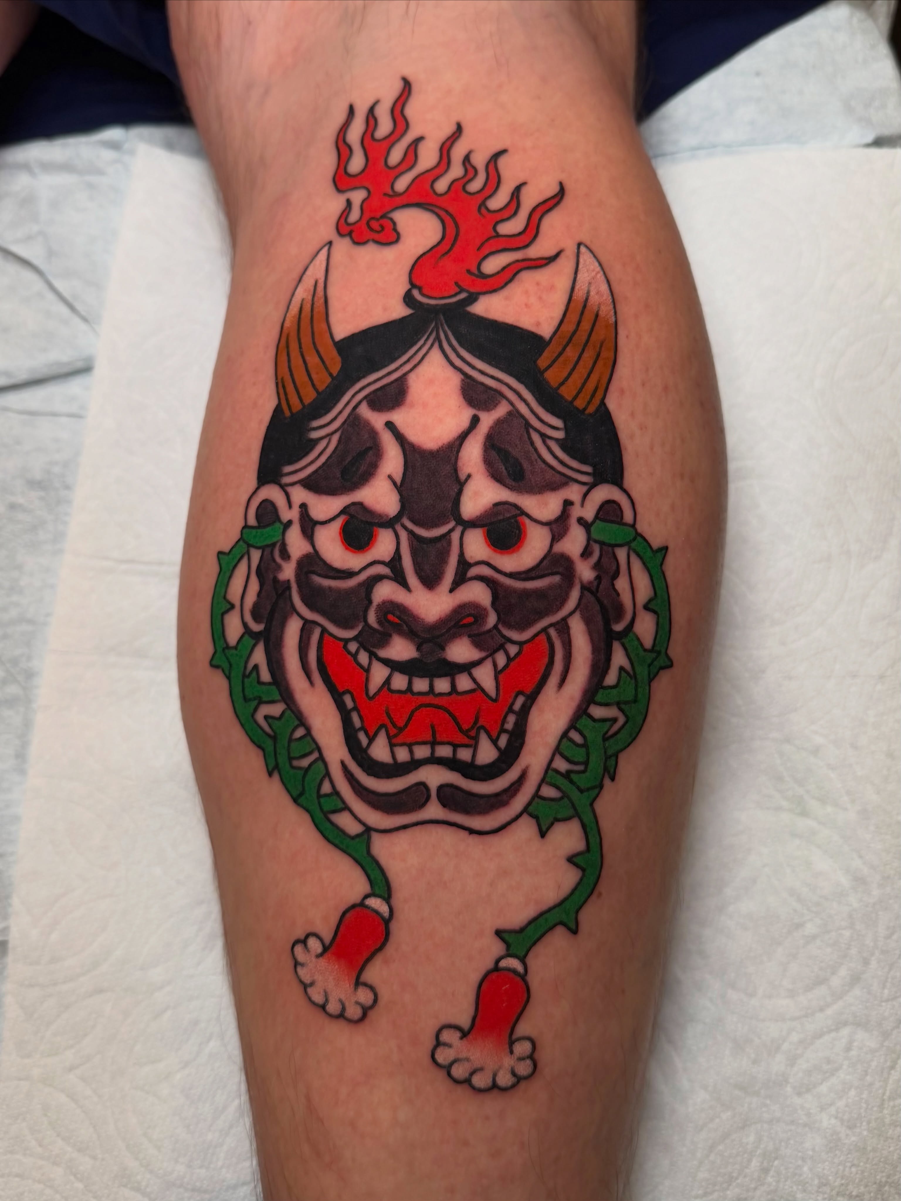 Demon mask japanese irezumi tattoo on the leg by Tyler Brown, San Diego, California