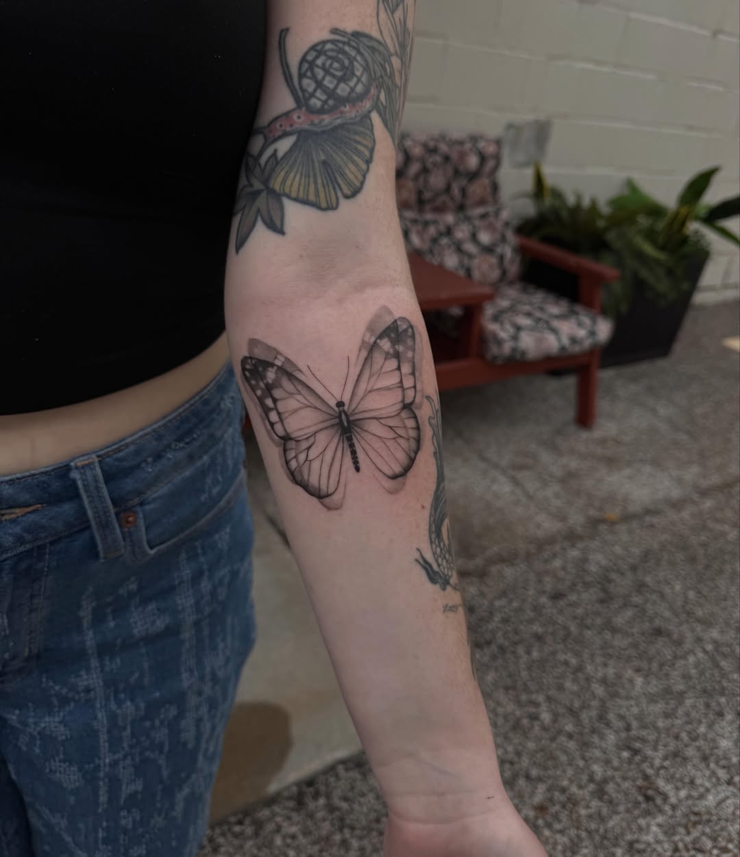 Butterfly black and grey tattoo on the forearm by Anna