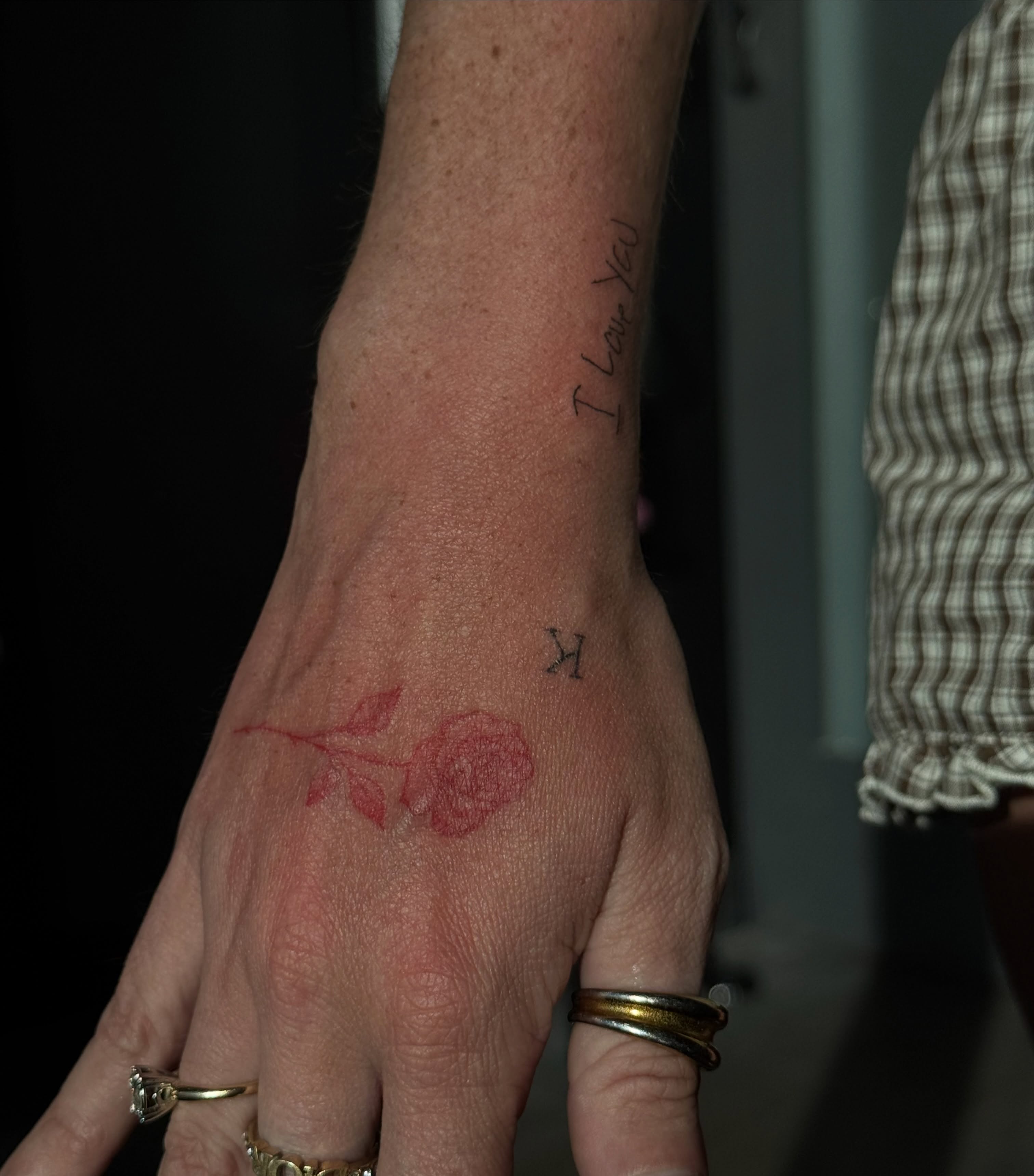 Rose fine line tattoo on the hand by Ryleigh Benjamin