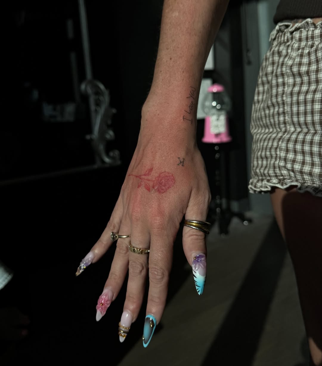 Rose American traditional tattoo on the hand by Ryleigh Benjamin