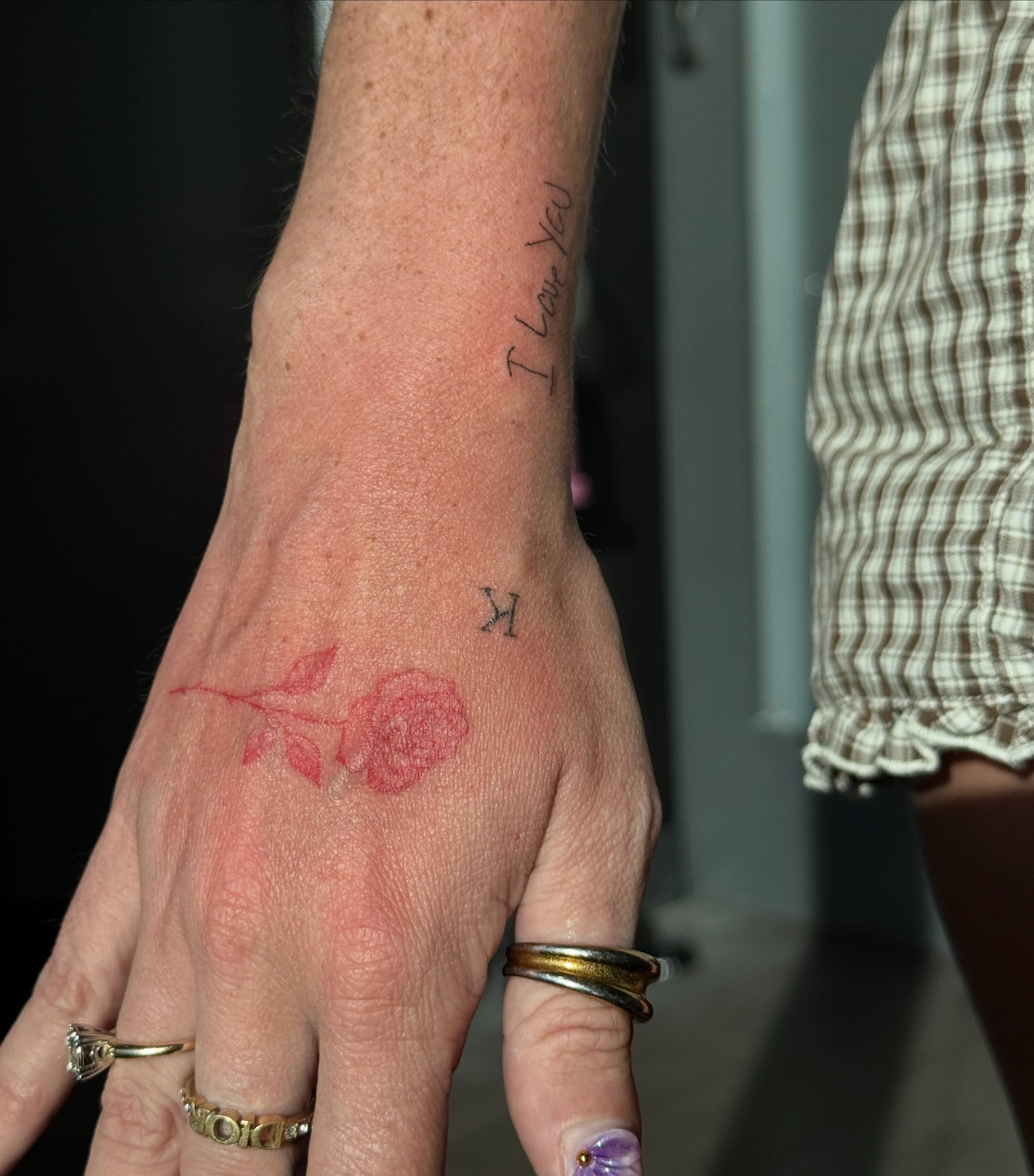 Rose fine line tattoo on the hand by Ryleigh Benjamin