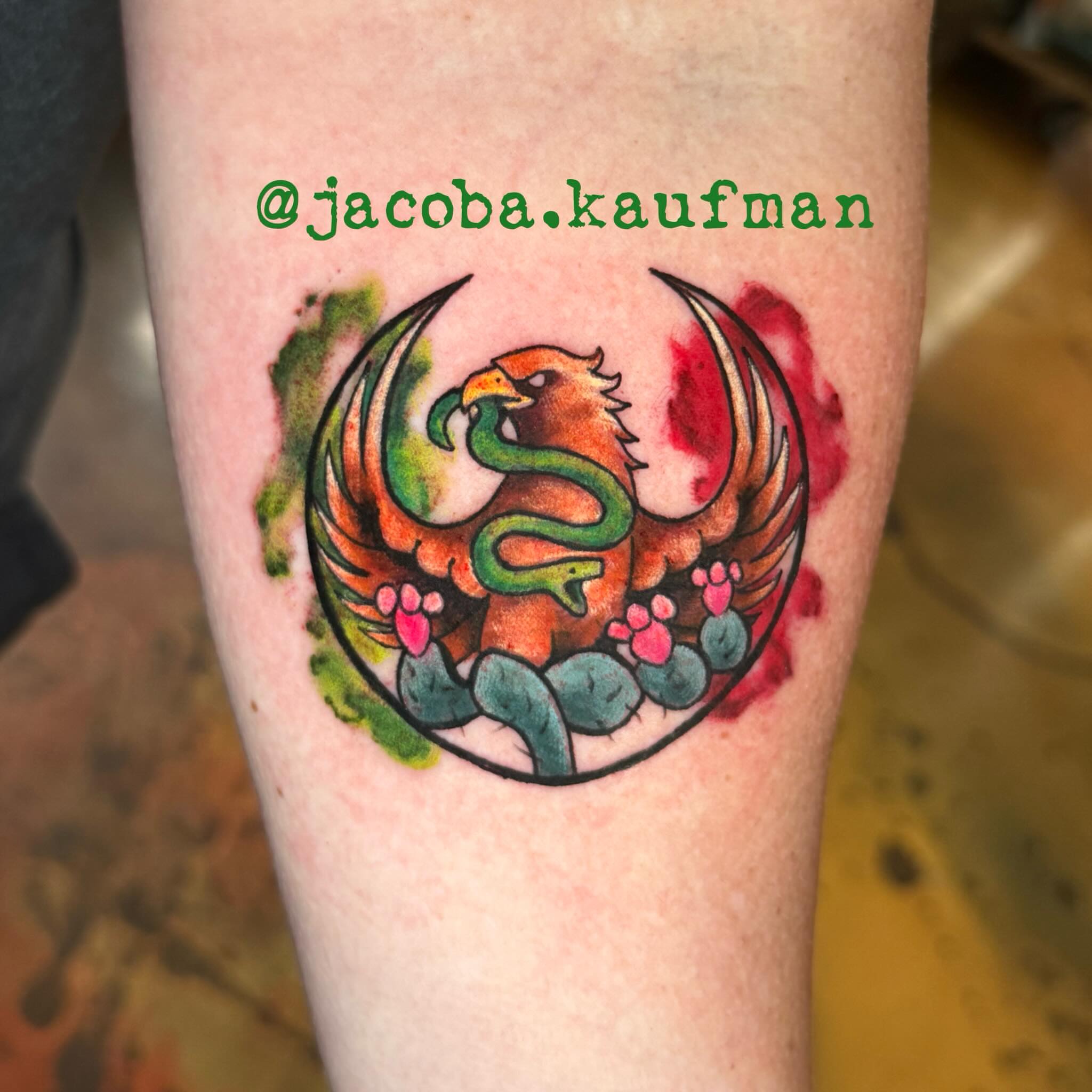 Phoenix and snake watercolor tattoo on the forearm by Jacoba Kaufman