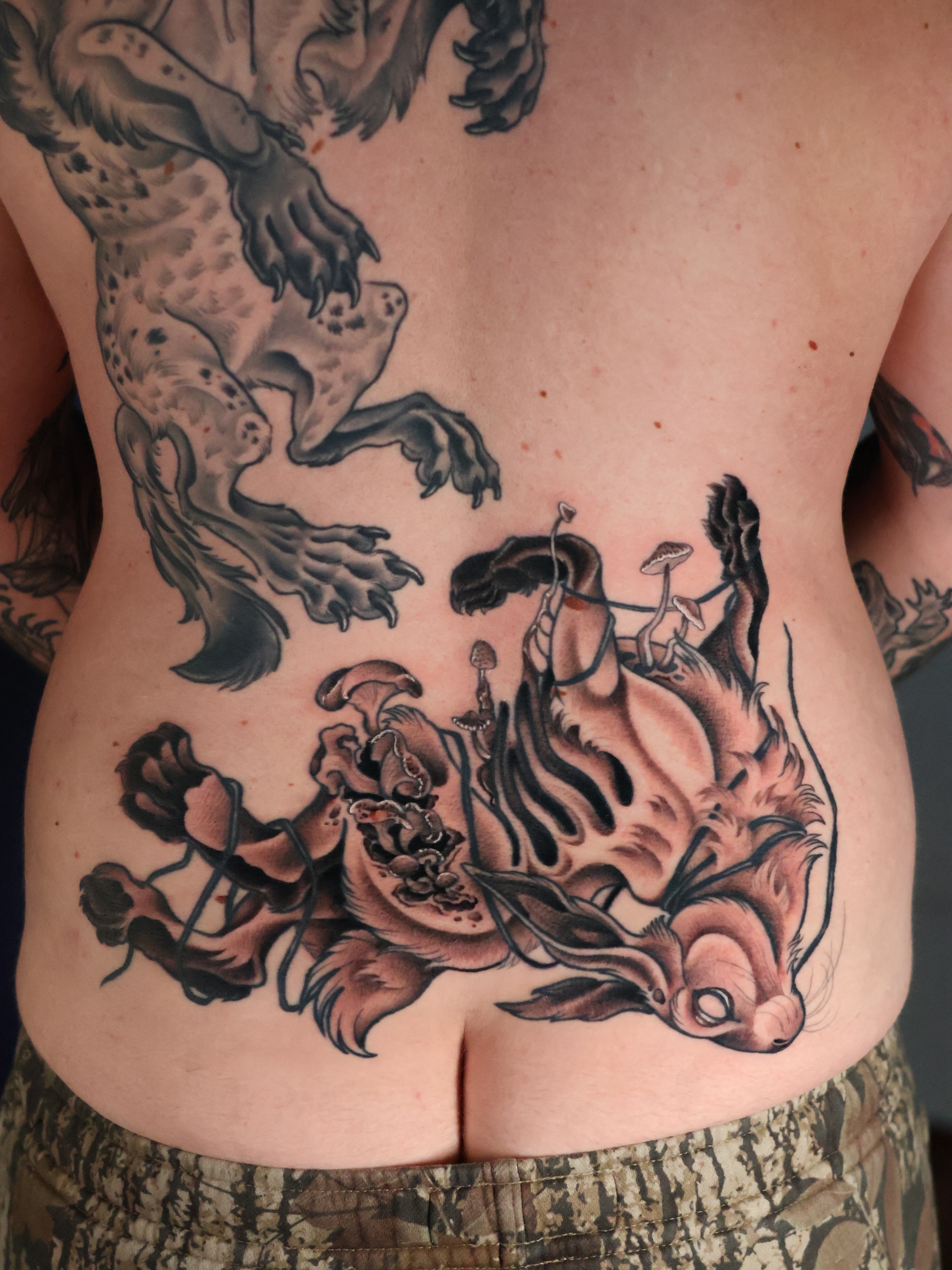 Tiger and dragon japanese irezumi tattoo on the torso by Sarah Baldwin