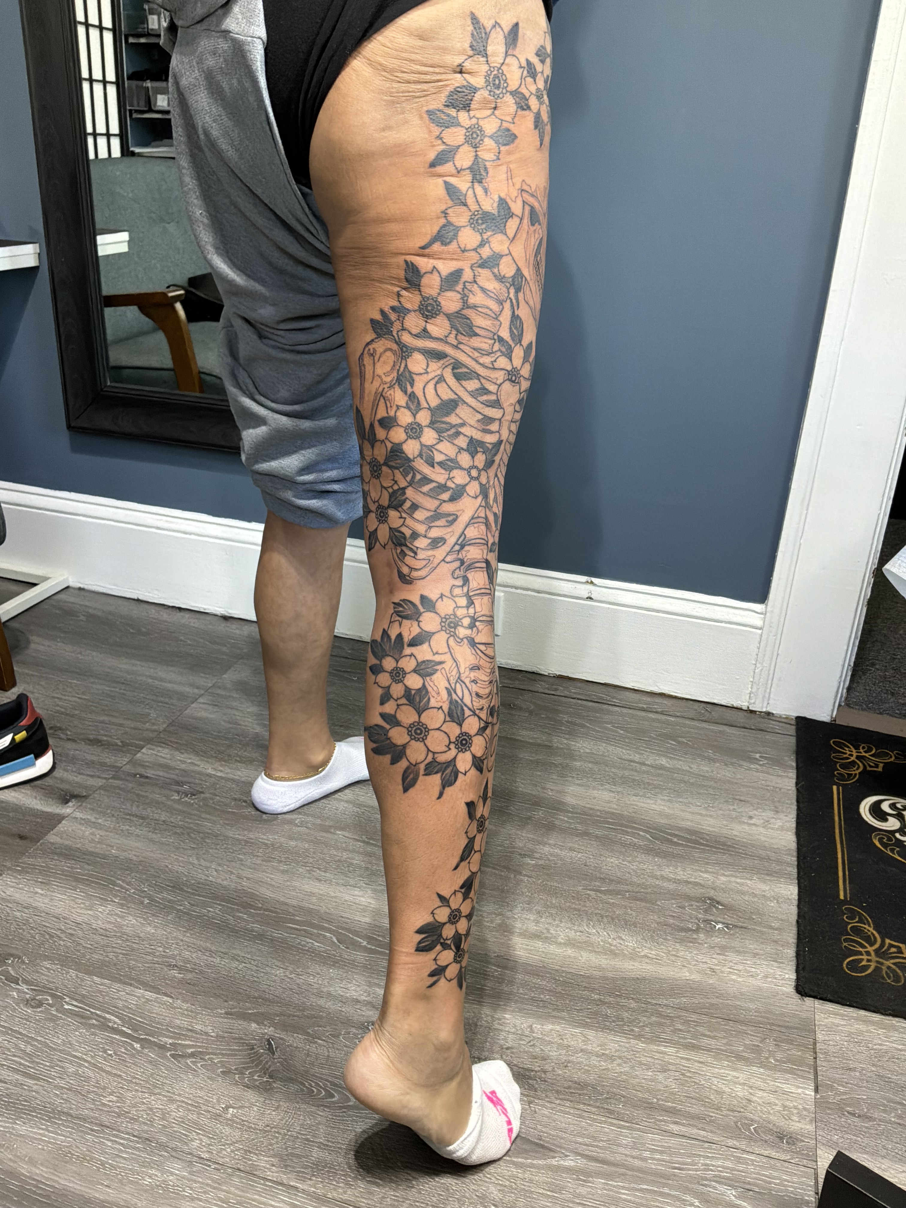 Floral pattern black and grey tattoo on the calf by German Romero-Rendon