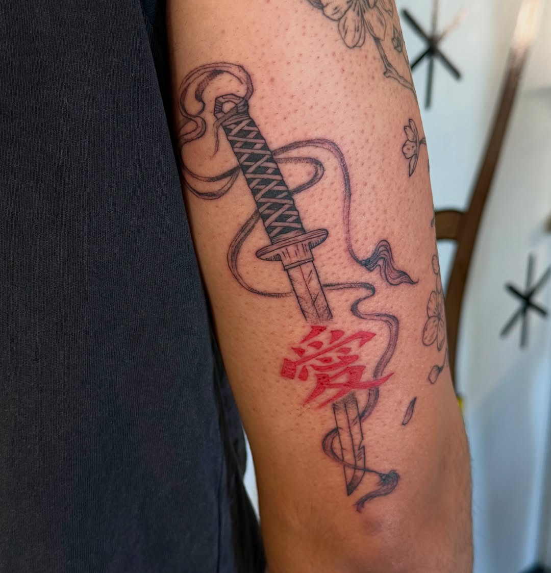Katana and kanji black and grey tattoo on the forearm by Sophia, New Carlisle, Ohio