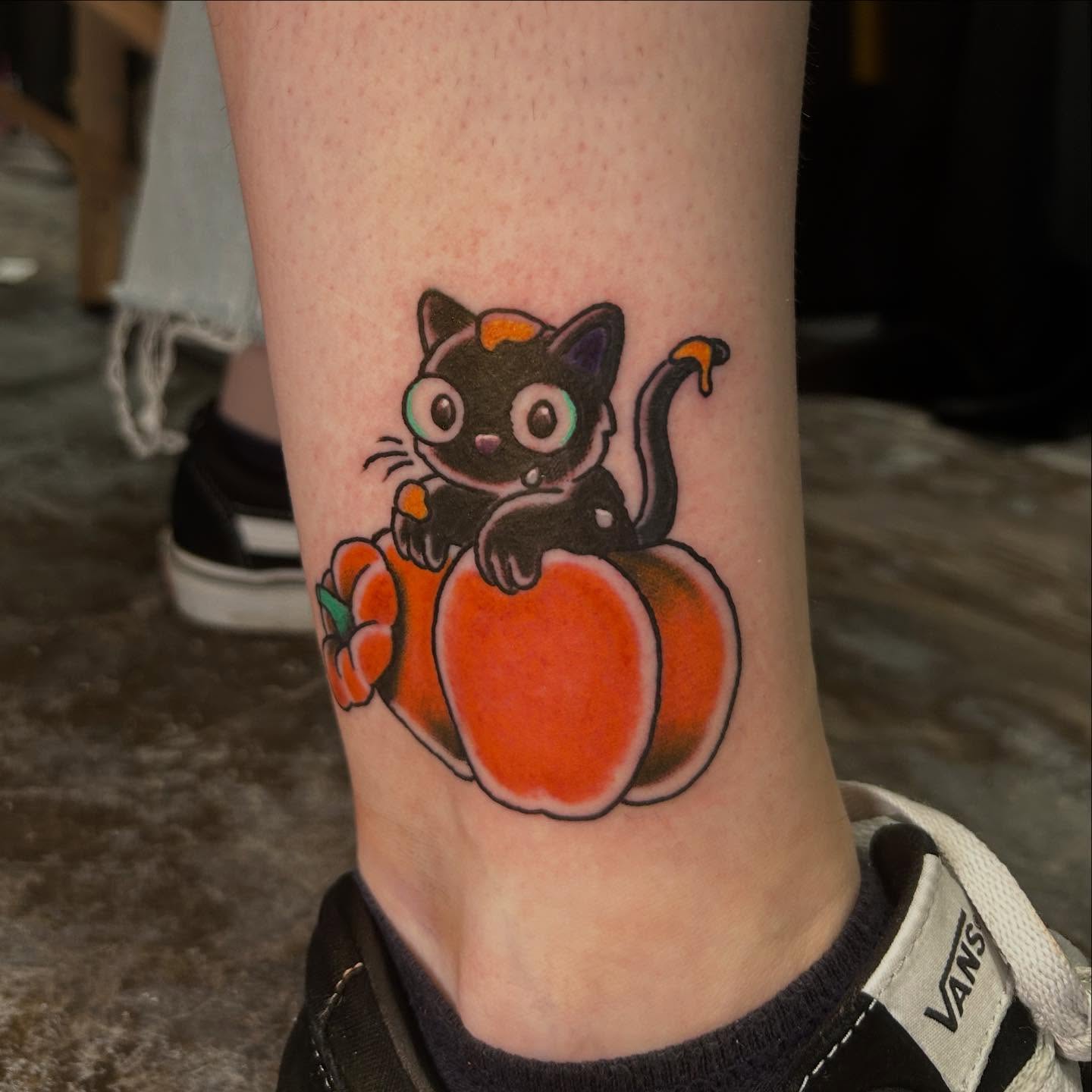 Cat and pumpkin new school tattoo on the forearm by Sarah π€π»