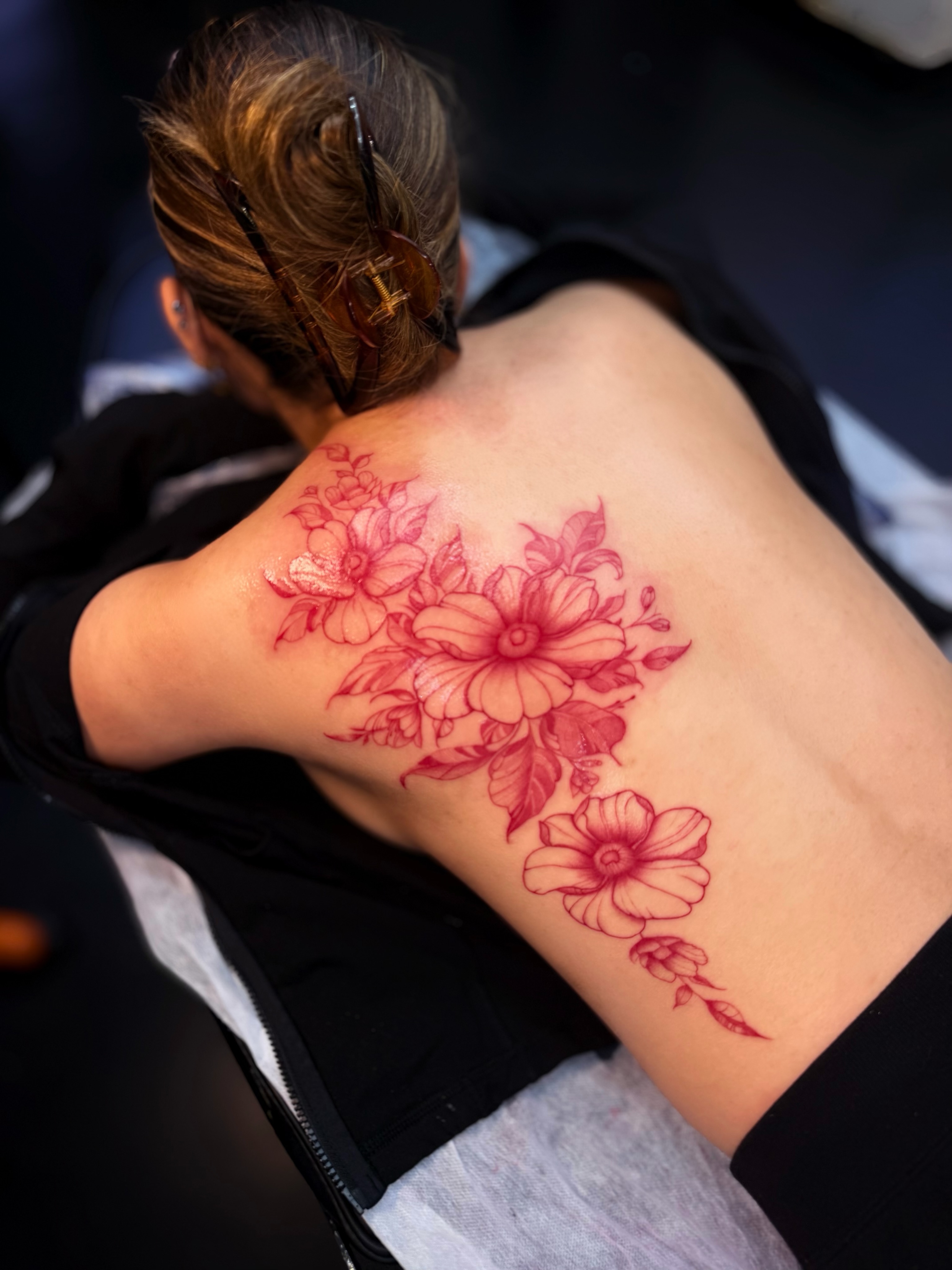 Floral bouquet dotwork tattoo on the back by Bryan Nguyen