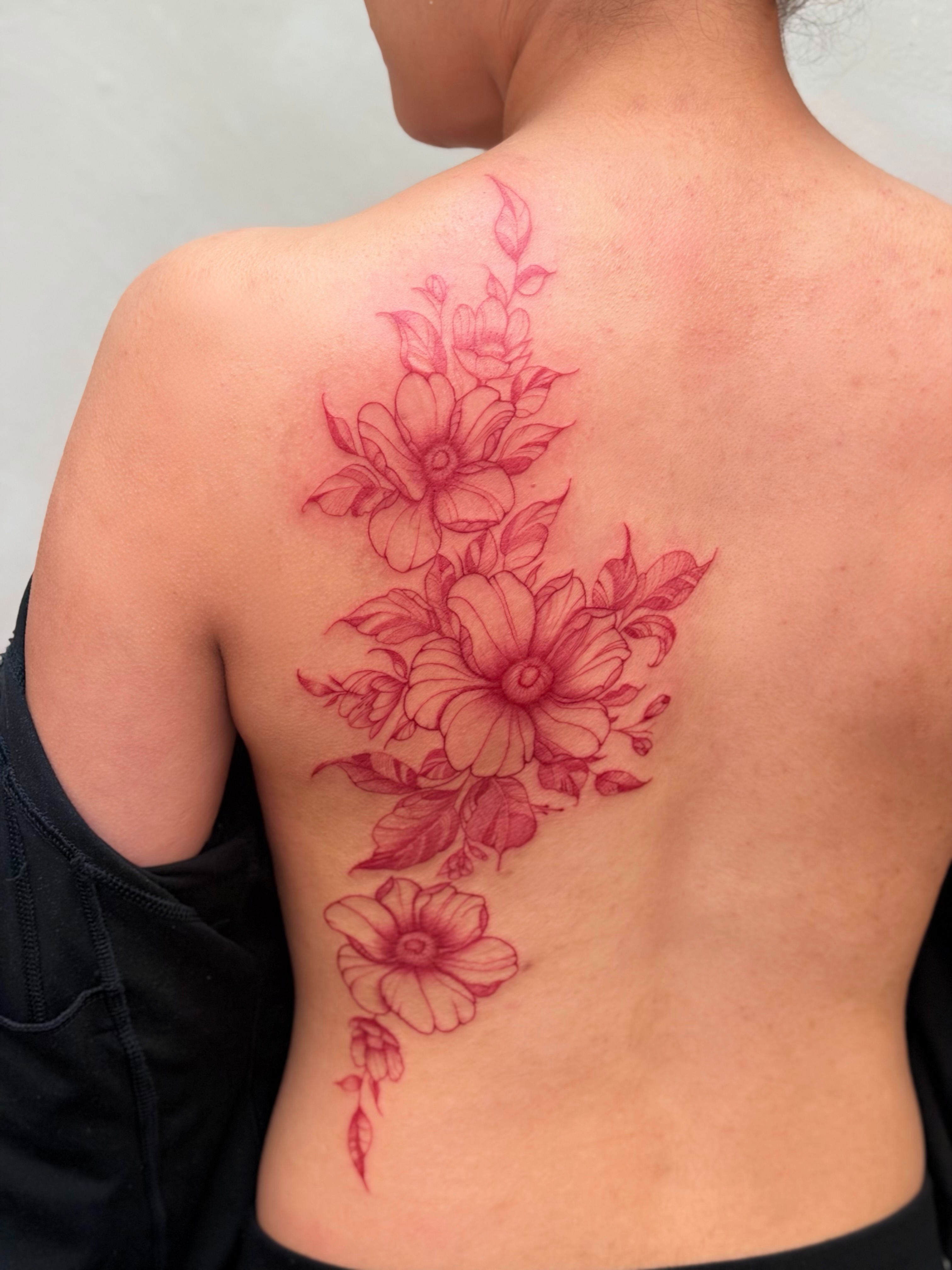 Flowers dotwork tattoo on the back by Bryan Nguyen