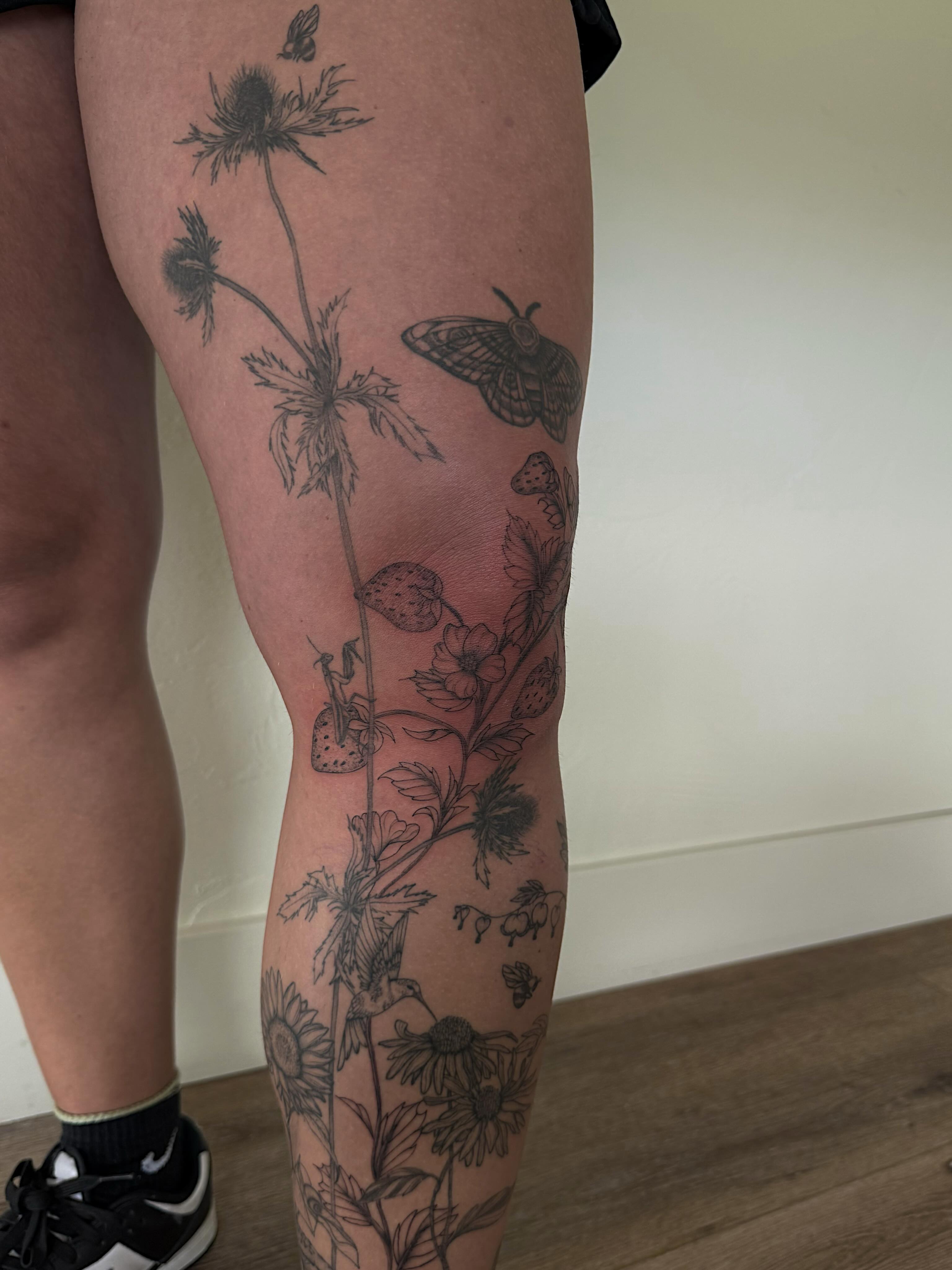 Flowers and butterflies black and grey tattoo on the leg by Shelby Lynn Bayles, Ogden, Utah