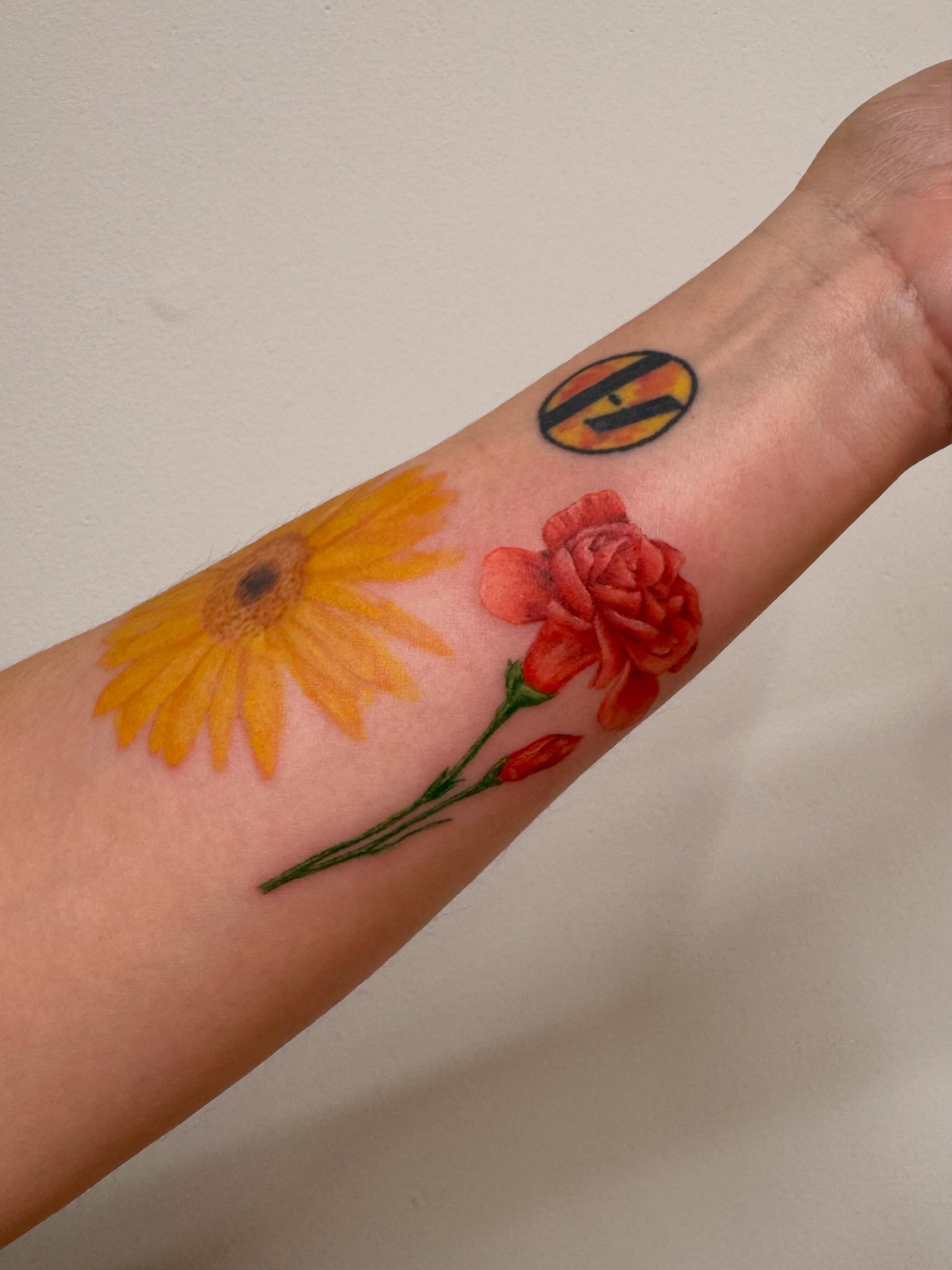 Sunflower and rose watercolor tattoo on the forearm by Enda 🧚🏻‍♀️