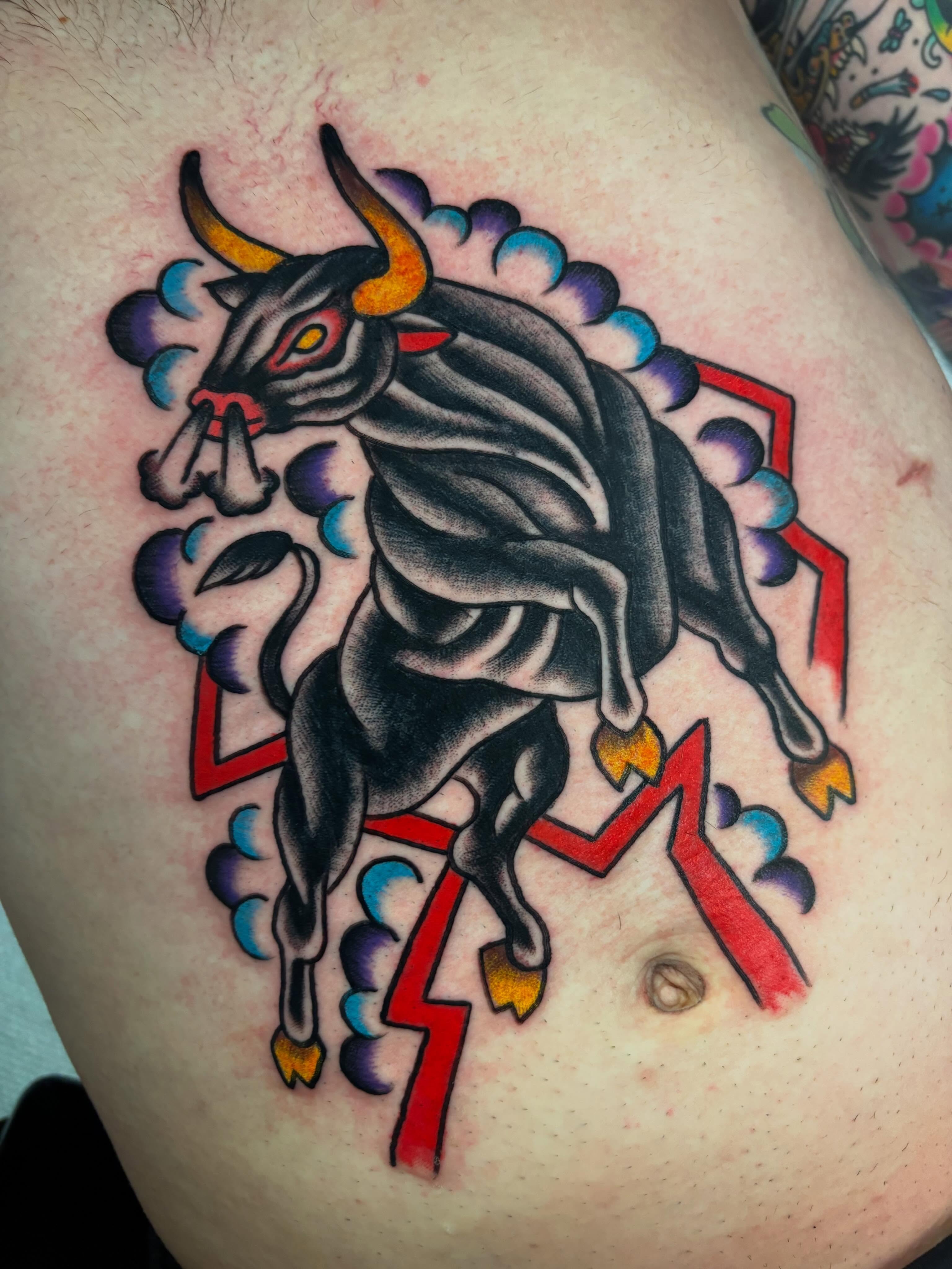 Bull American traditional tattoo on the thigh by Chris Dufresne