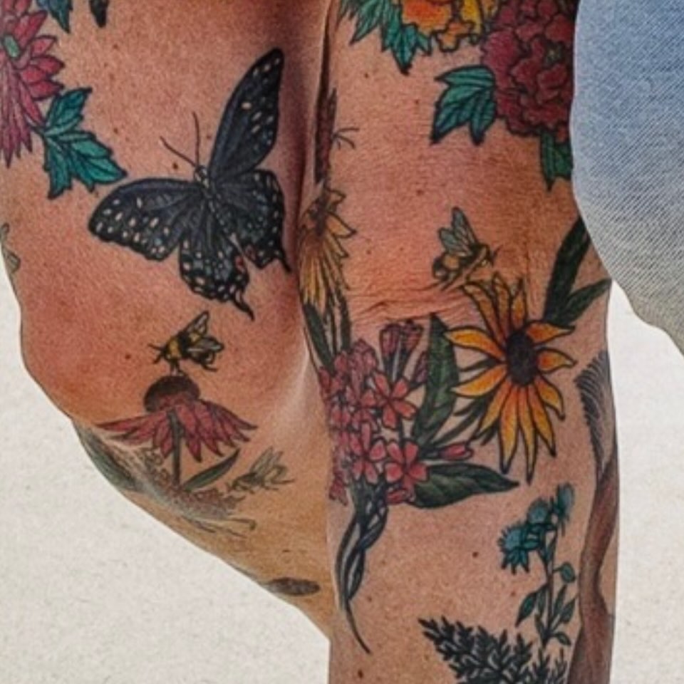 Floral and insect new school tattoo on the forearm by Laura Saadati Kepper