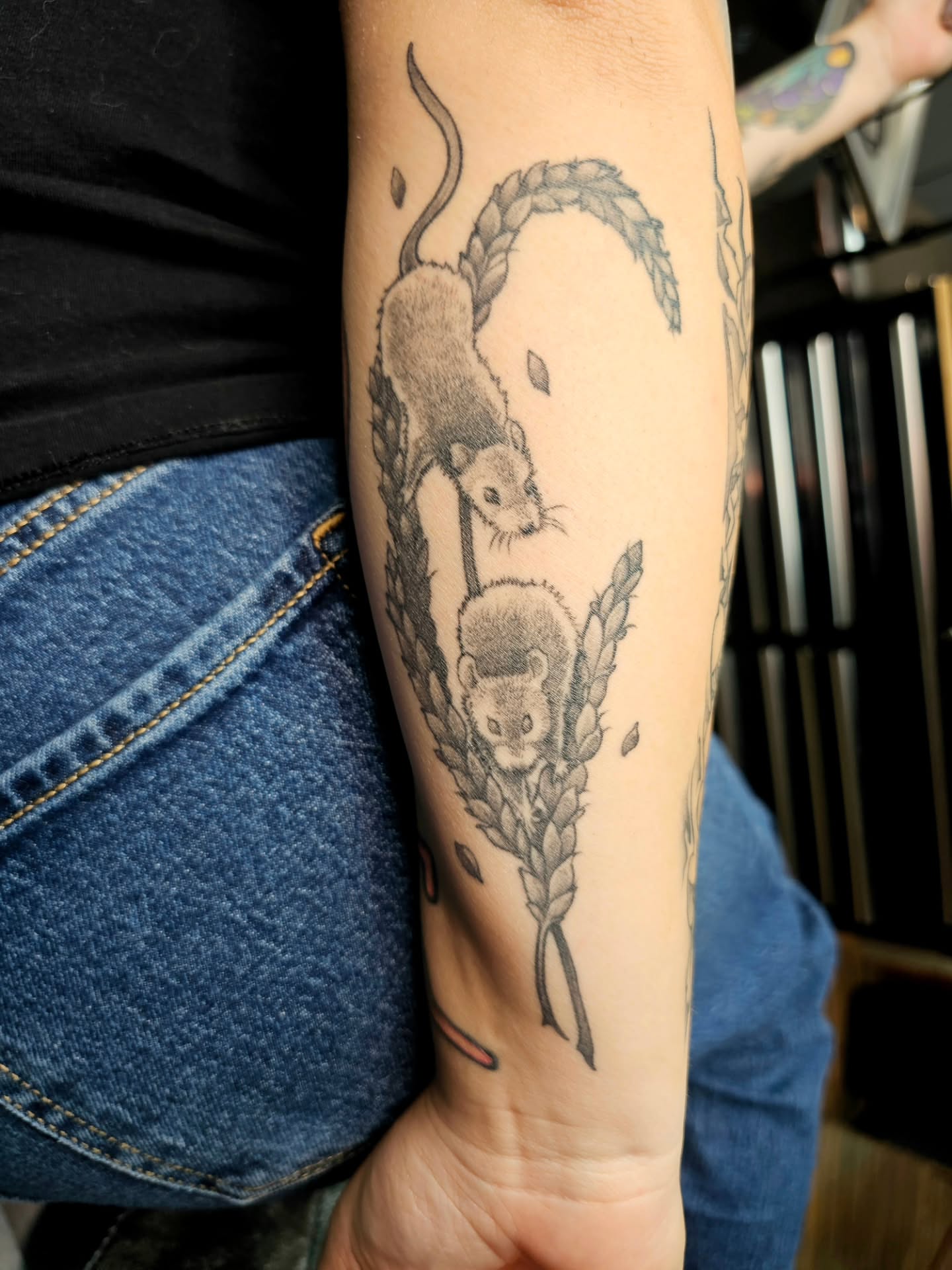 Mice and wheat black and grey tattoo on the forearm by Adriannah Esparza