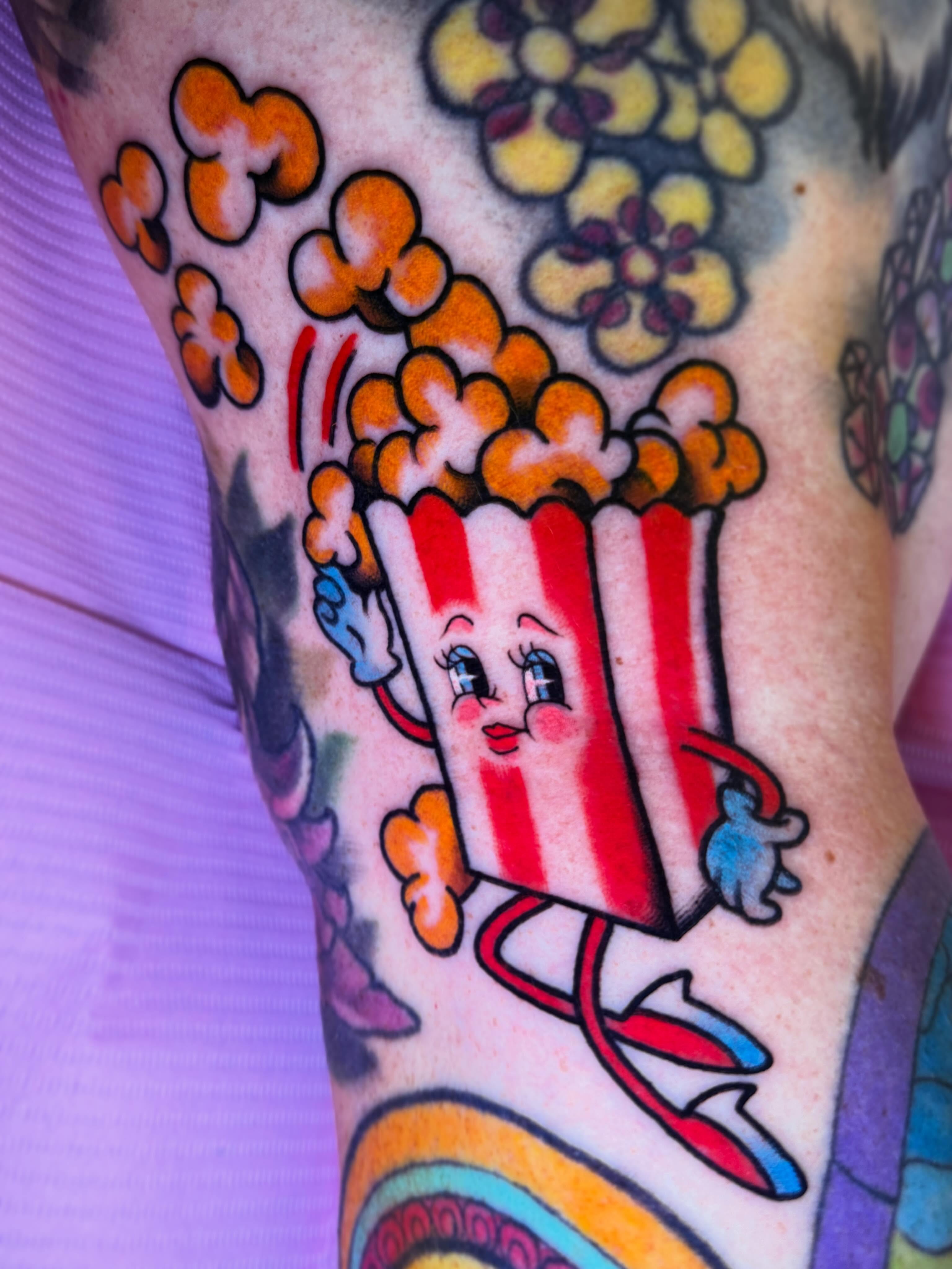 Popcorn character American traditional tattoo on the forearm by Cassie O'Neal DeBord