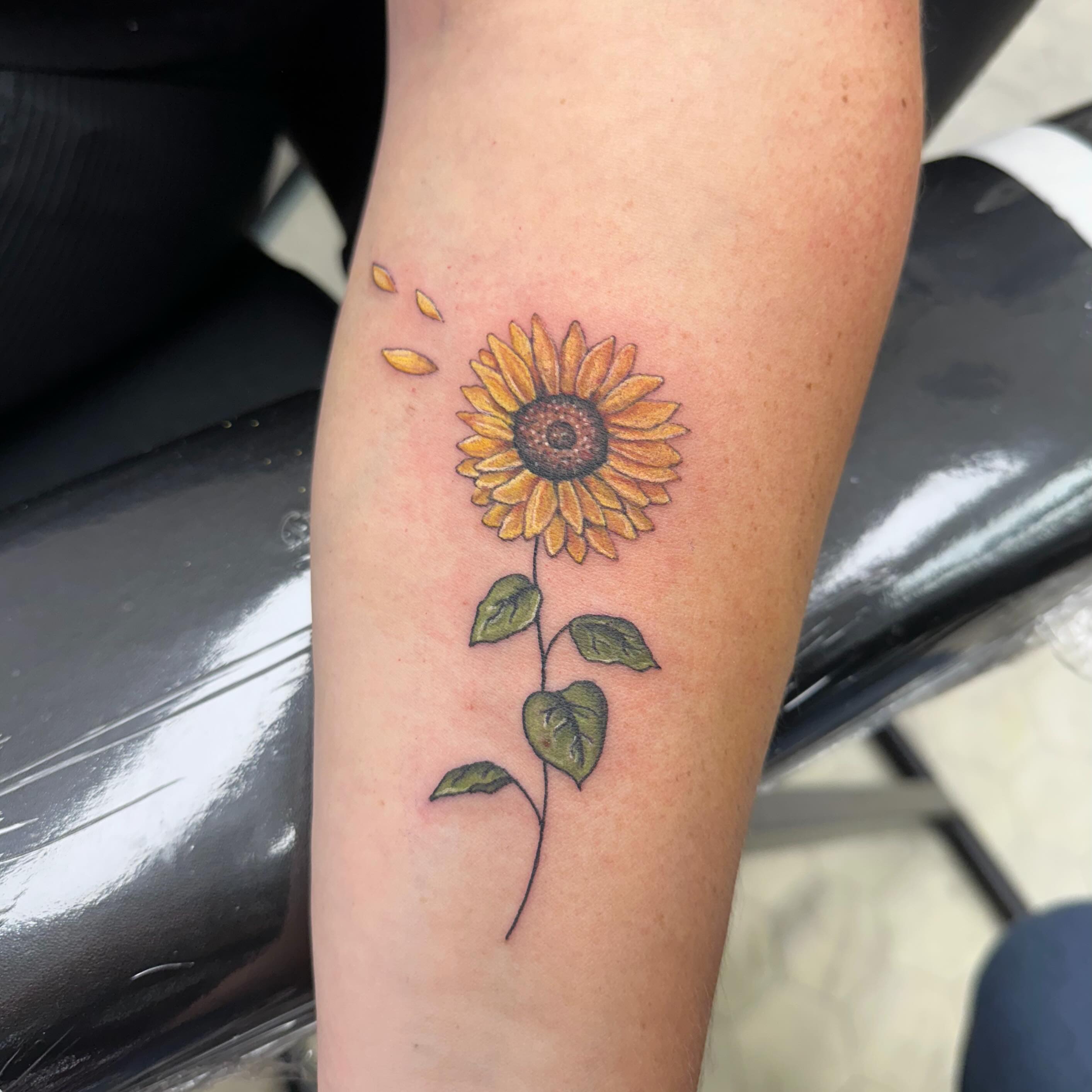 Sunflower realism tattoo on the forearm by Nicki Hoverson