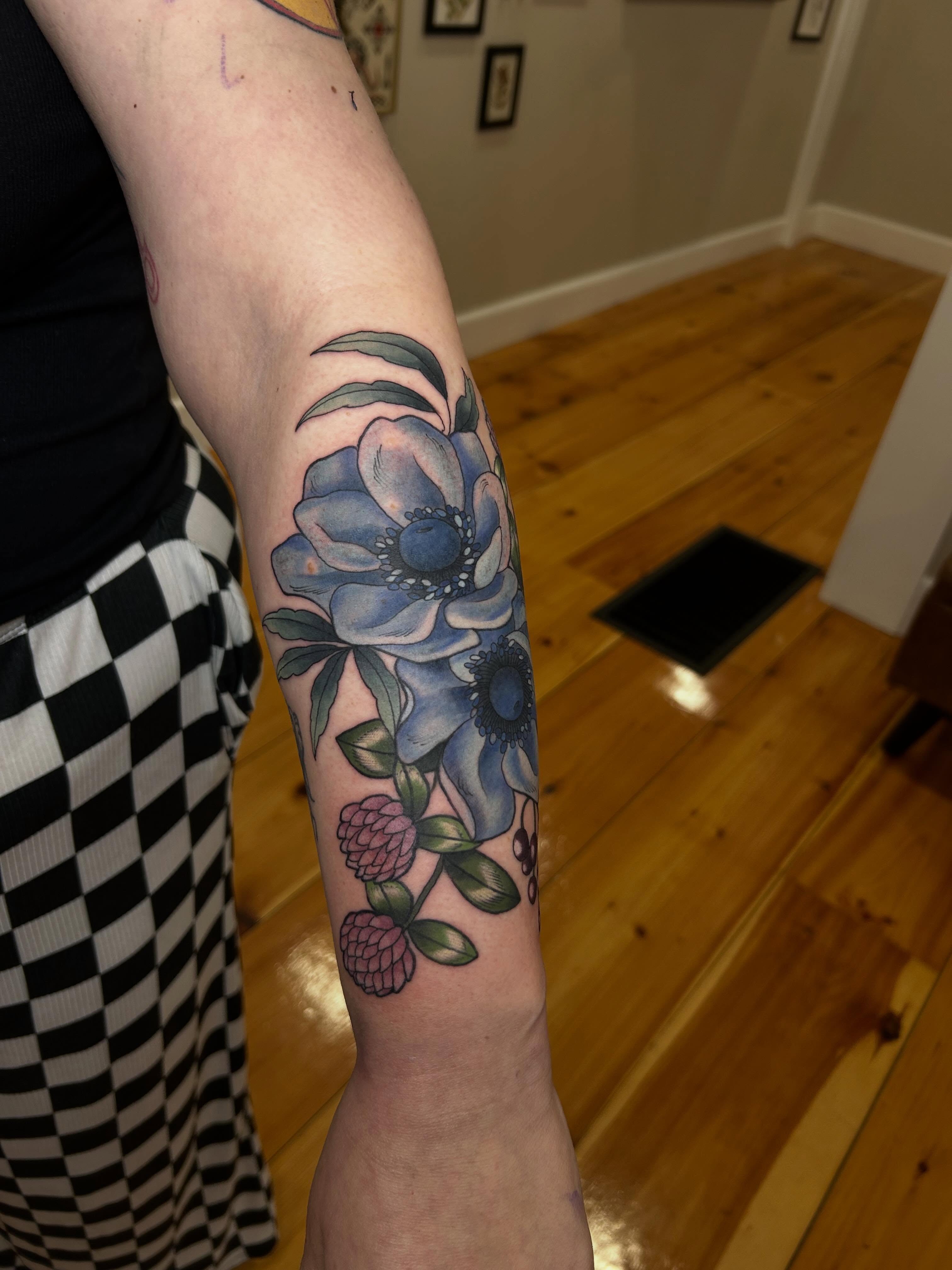 Blue flowers realism tattoo on the forearm by 𝓗𝓪𝔂𝓵𝓮𝔂 𝓢𝓪𝓿𝓪𝓰𝓮