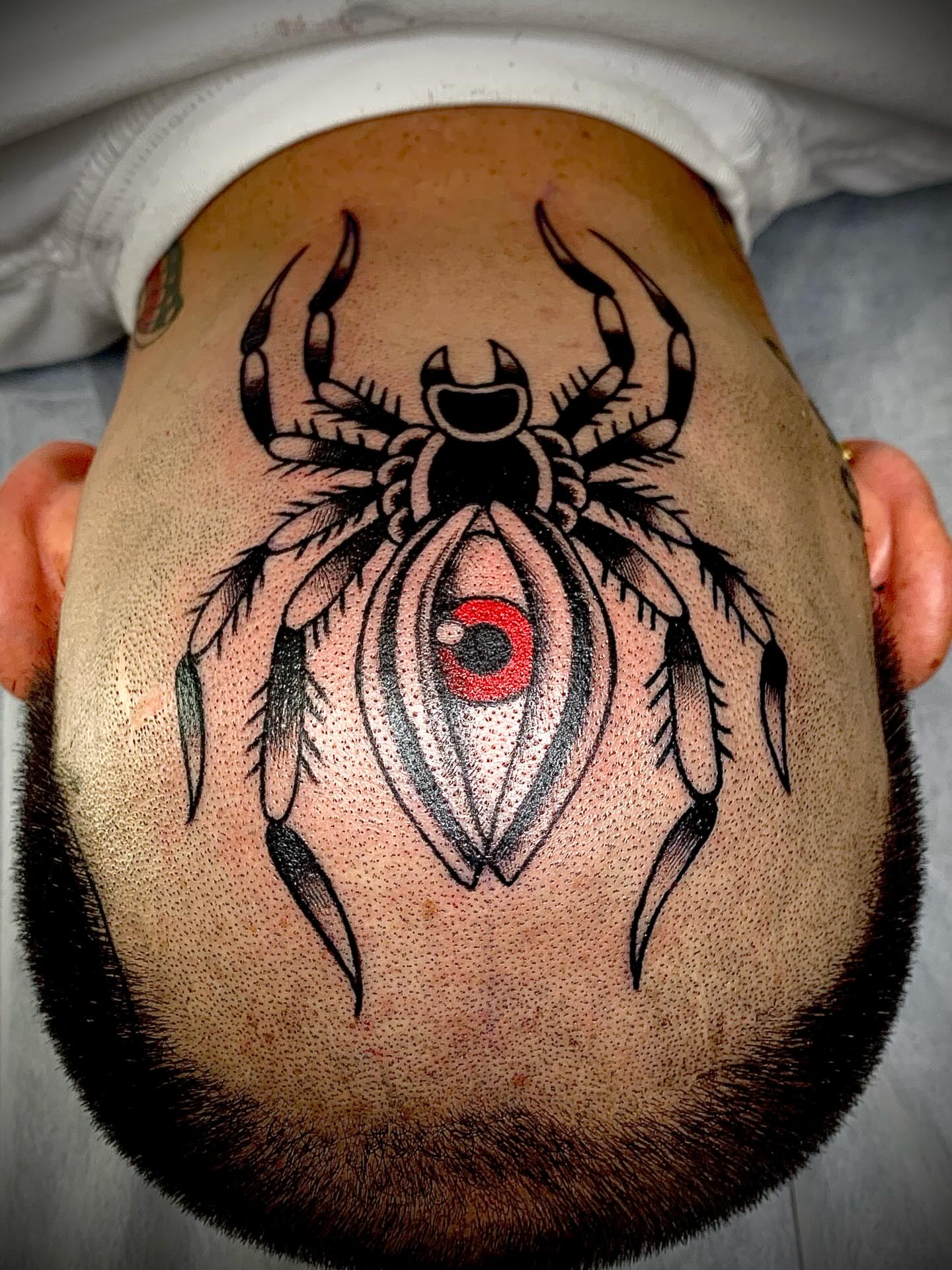 Spider dotwork tattoo on the head by El Kapitan