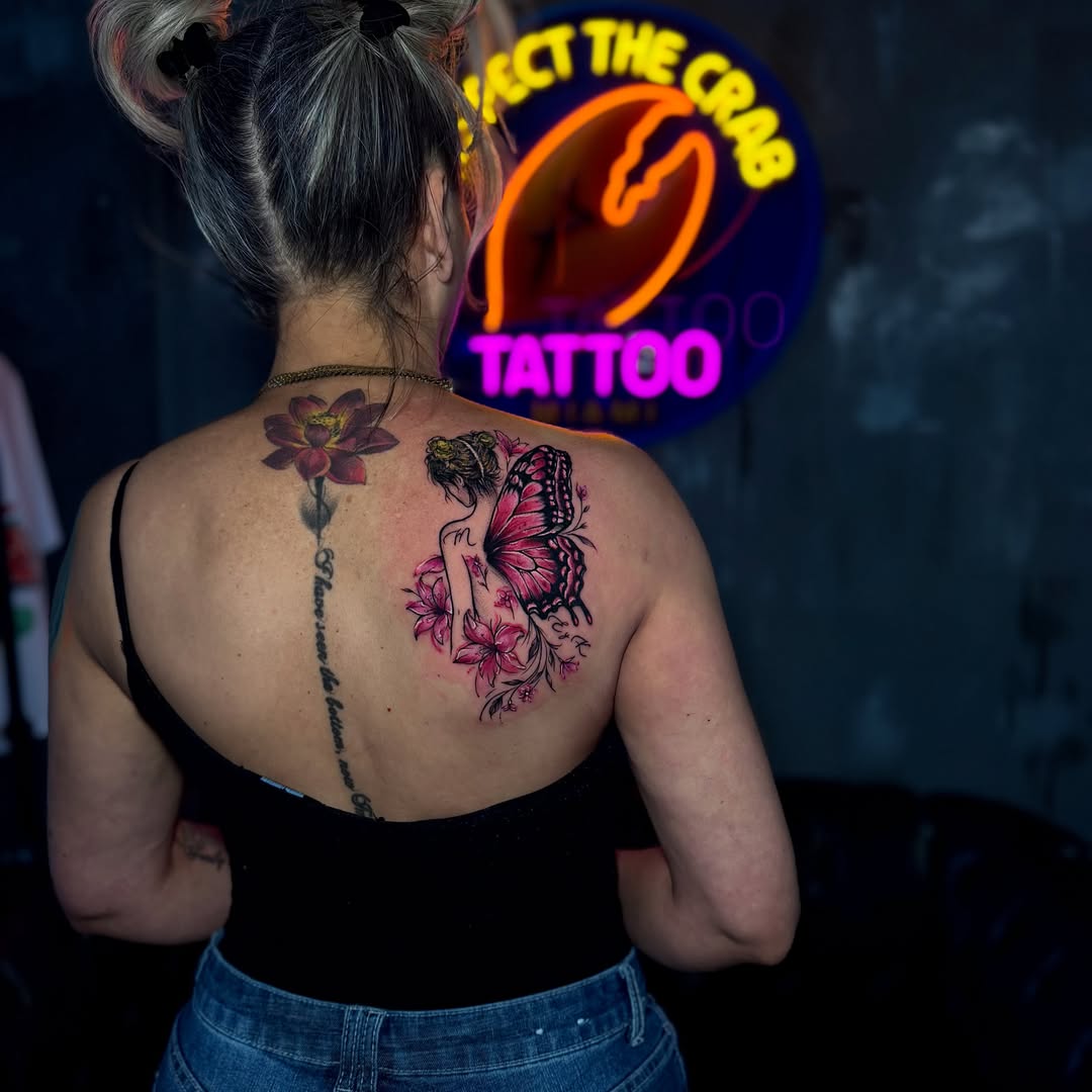 Butterfly and flowers new school tattoo on the back by Keyla Valdes, Miami, Florida