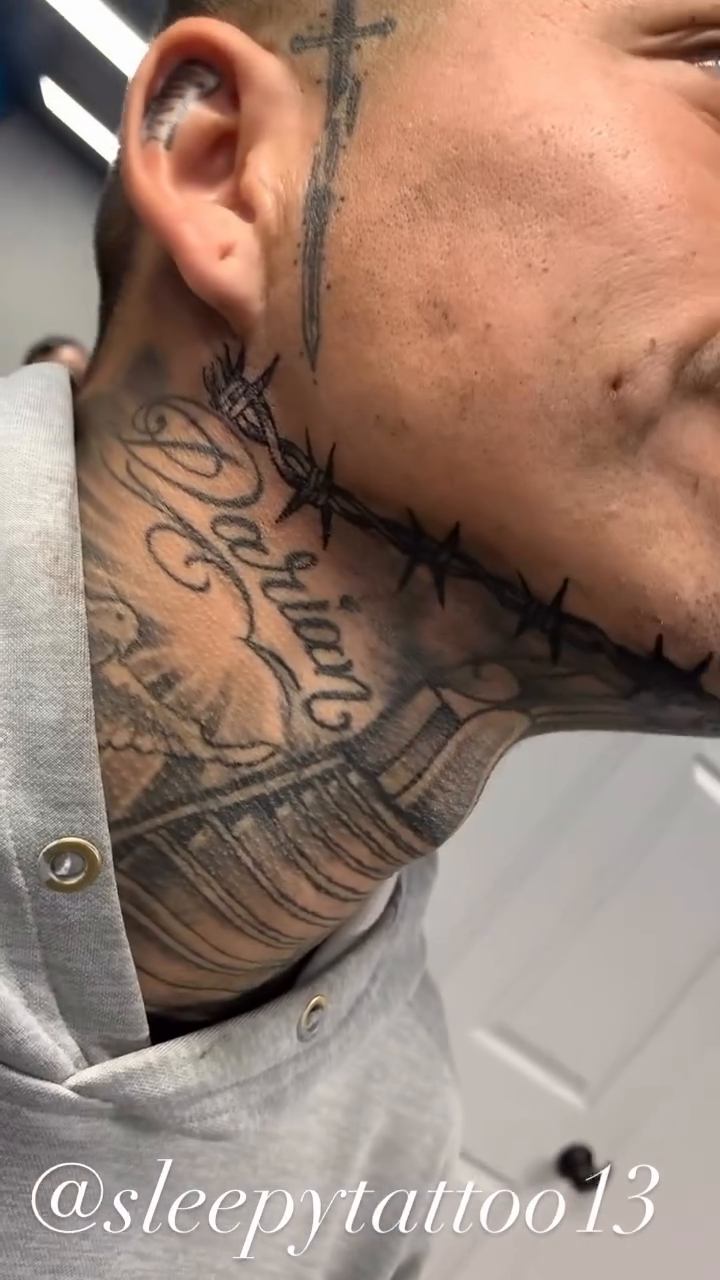 Barbed wire and ornamental neck tattoo blackwork tattoo on the neck by Brian Cruz Garcia