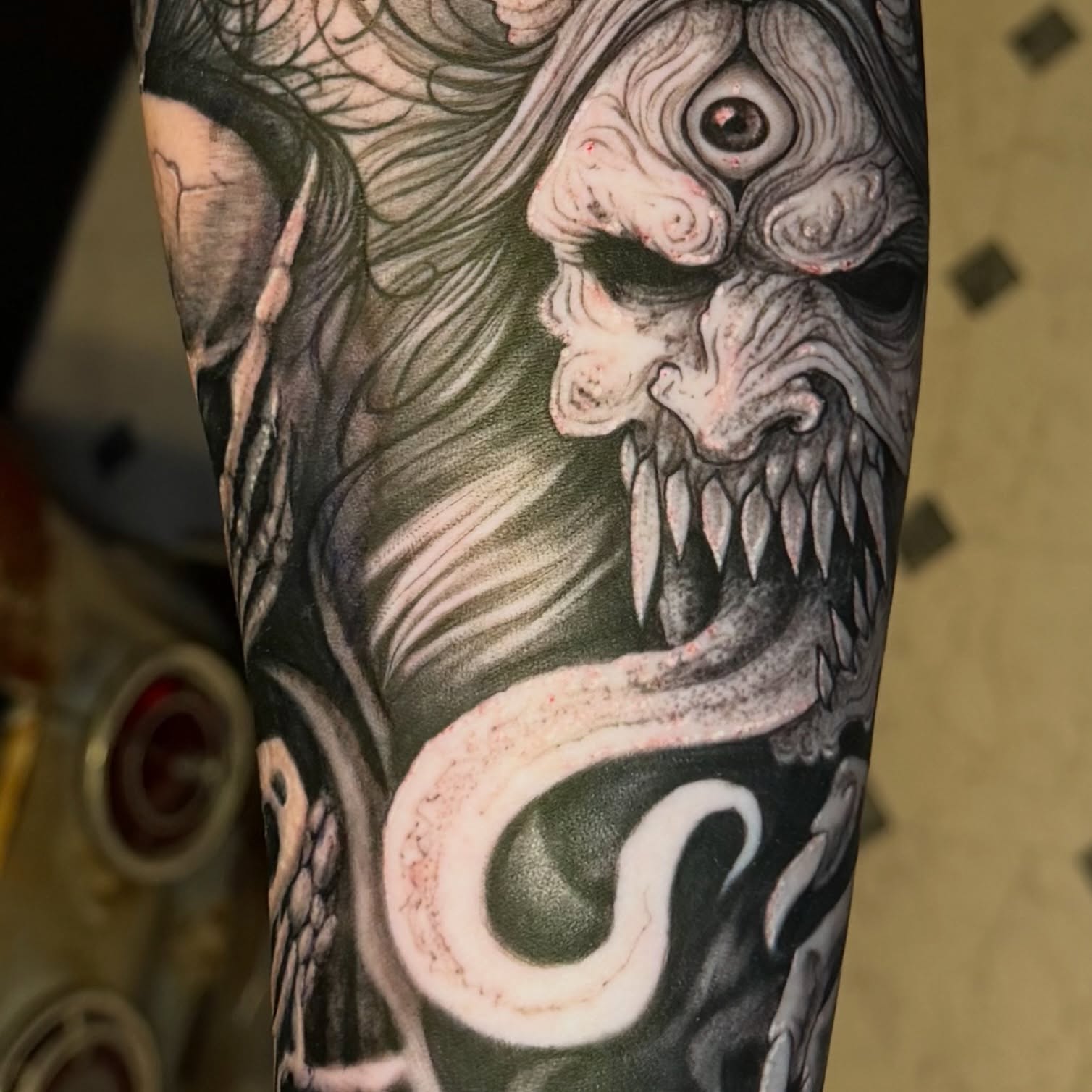Demon dark realism tattoo on the forearm by Eugene Oregon tattoo artist