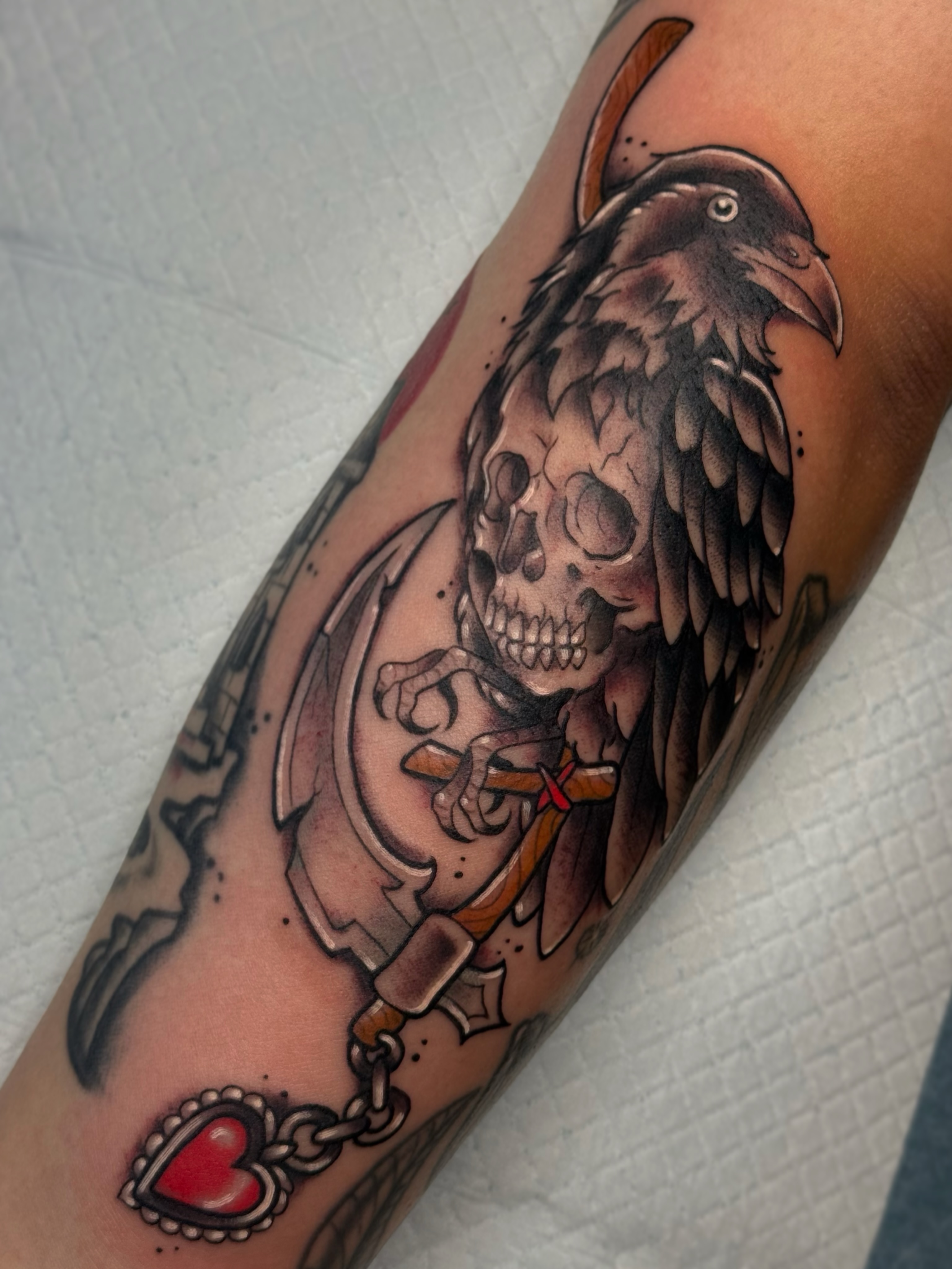 Skull and raven American traditional tattoo on the forearm by Chelsea Graham, Seattle, Washington