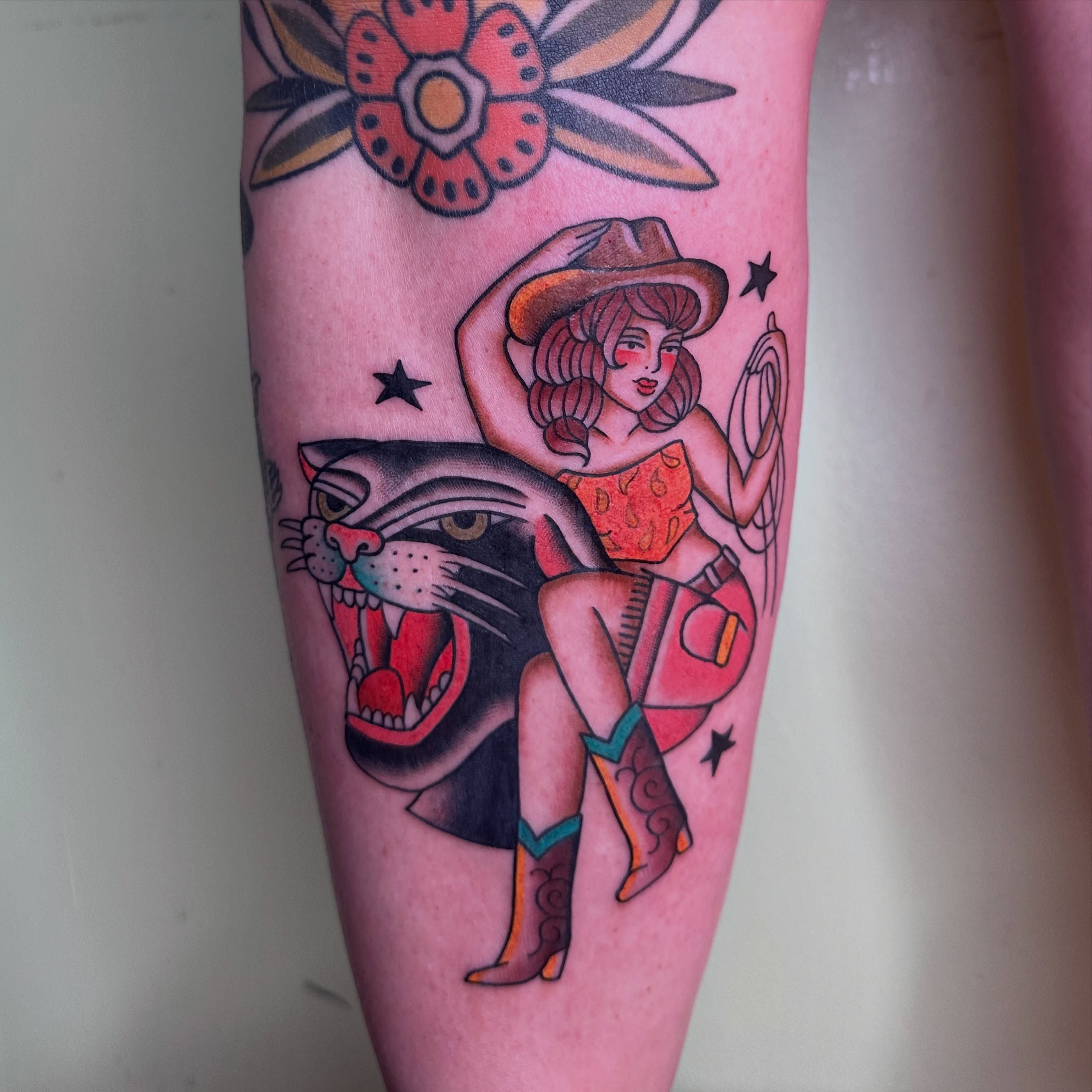 Cowgirl and panther American traditional tattoo on the forearm by Brieana Smith