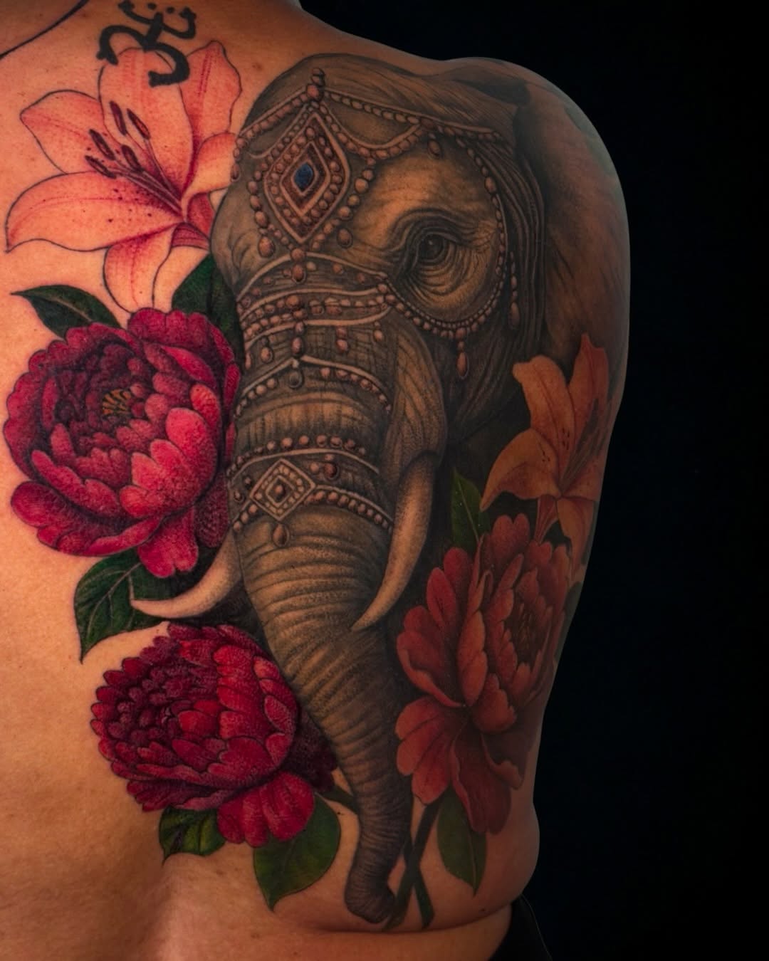 Elephant and flowers neo-traditional tattoo on the shoulder by ✨ Tattoo Artist