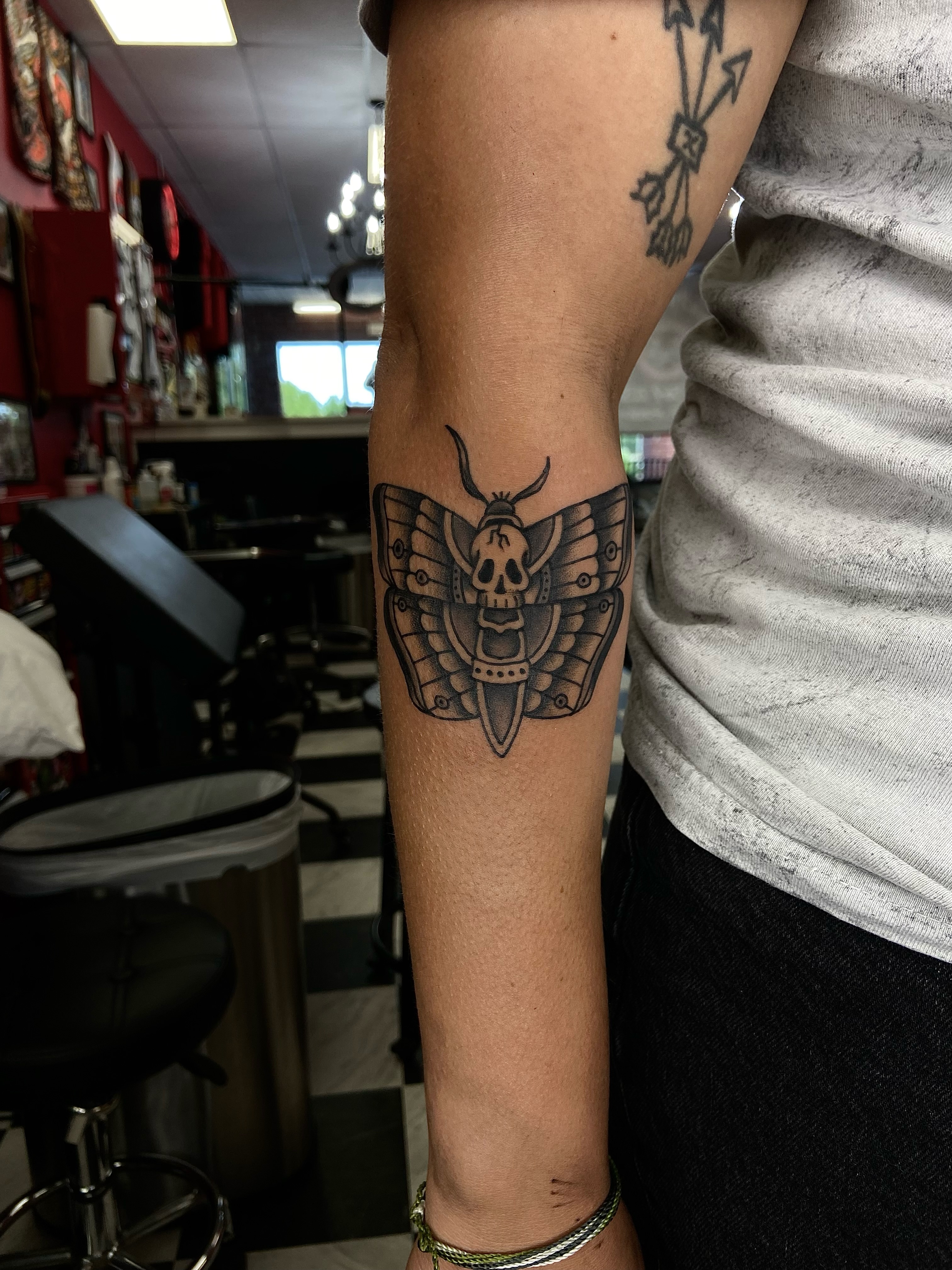 Moth skull black and grey tattoo on the forearm by R y a n S m i t h