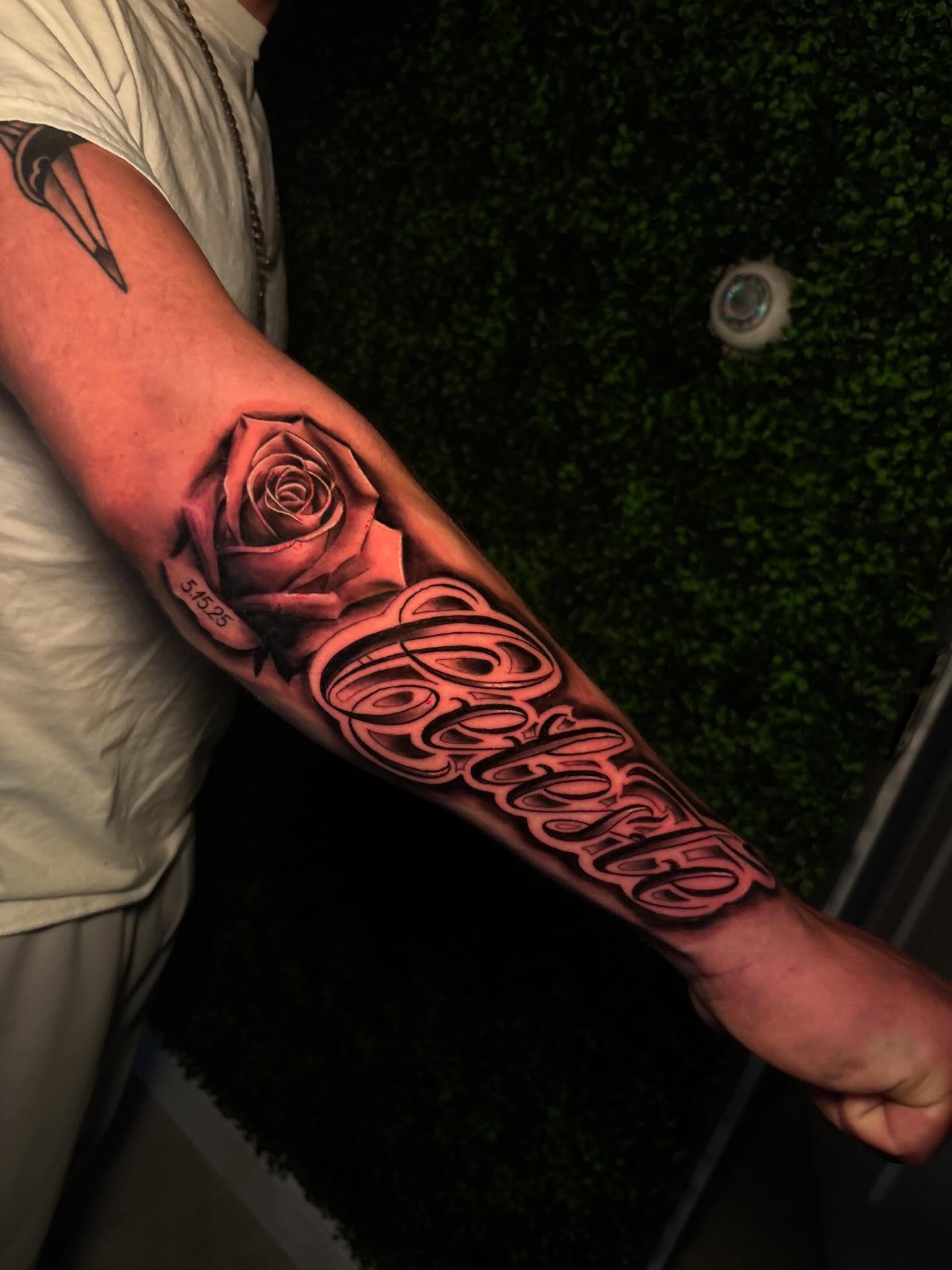Rose and script realism tattoo on the forearm by Bella Buonopane