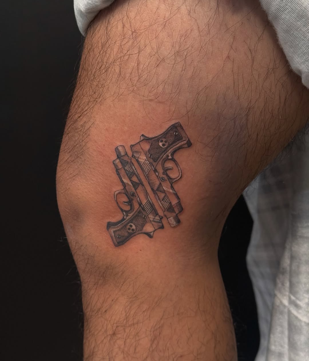 Two crossed pistols minimalist tattoo on the forearm by dewduls :), Berkeley, California