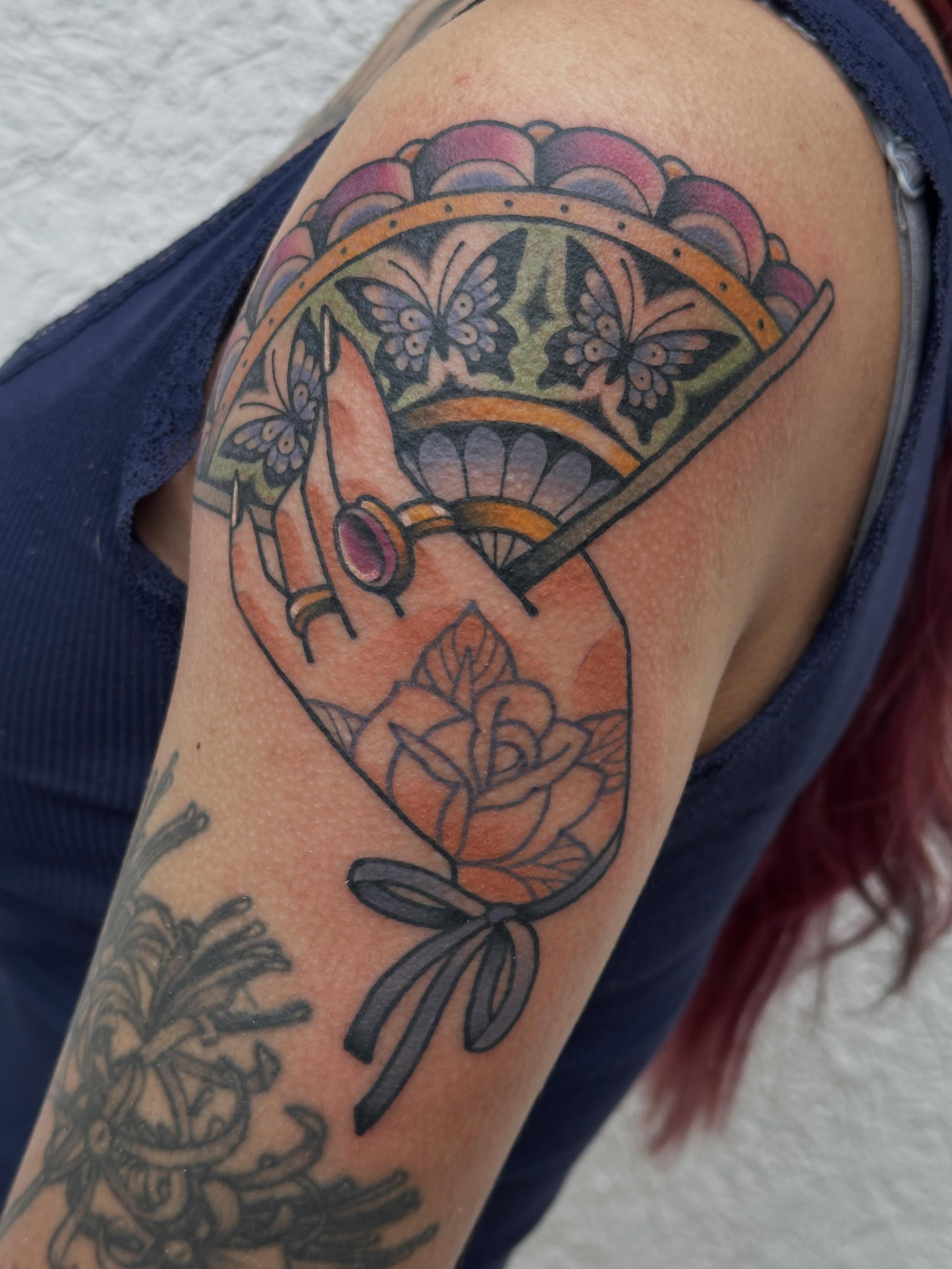 Rose bouquet American traditional tattoo on the shoulder by Ginny Marie Kalnasy
