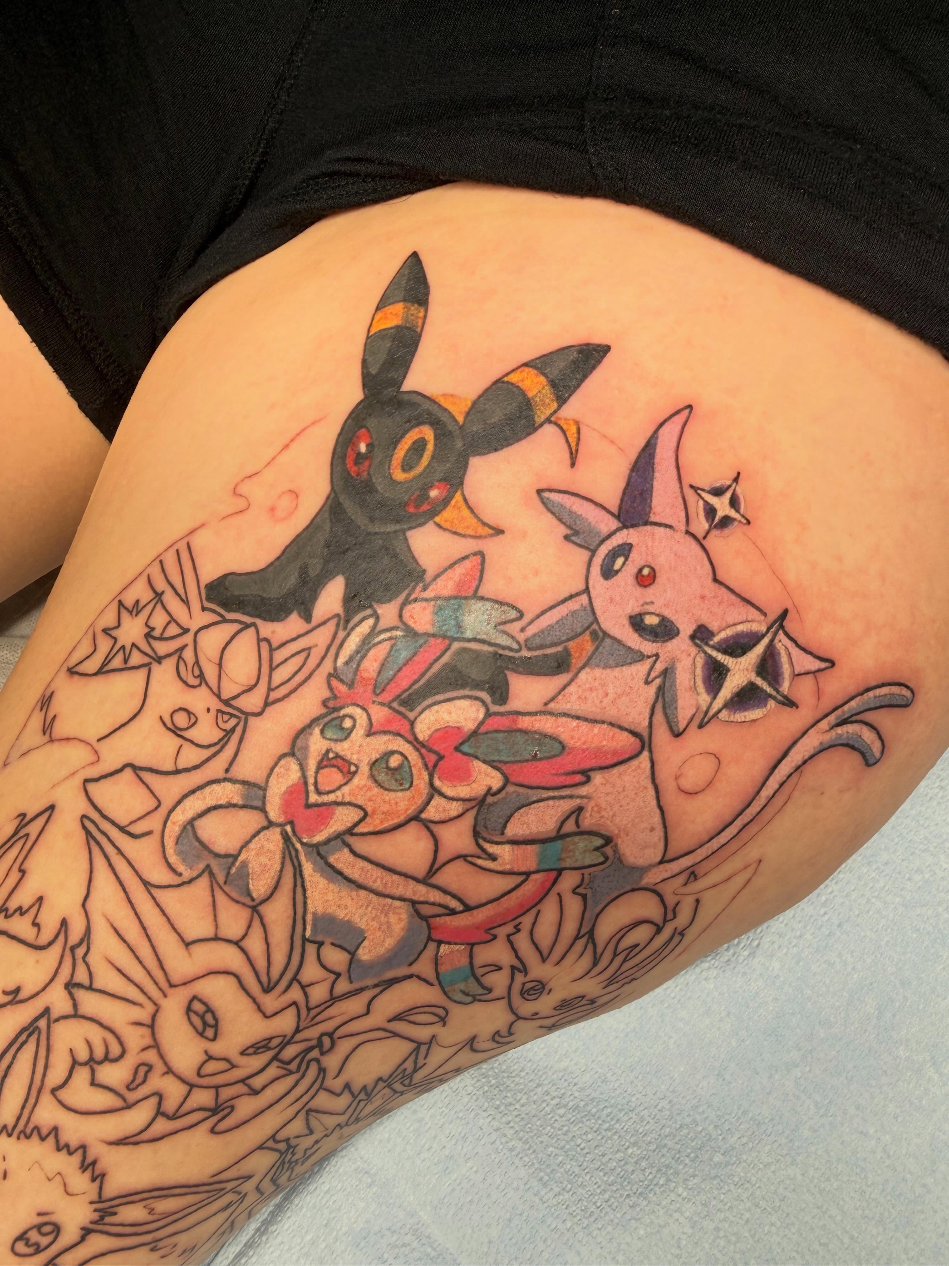 Eevee evolution family dotwork tattoo on the thigh by Mike Corn