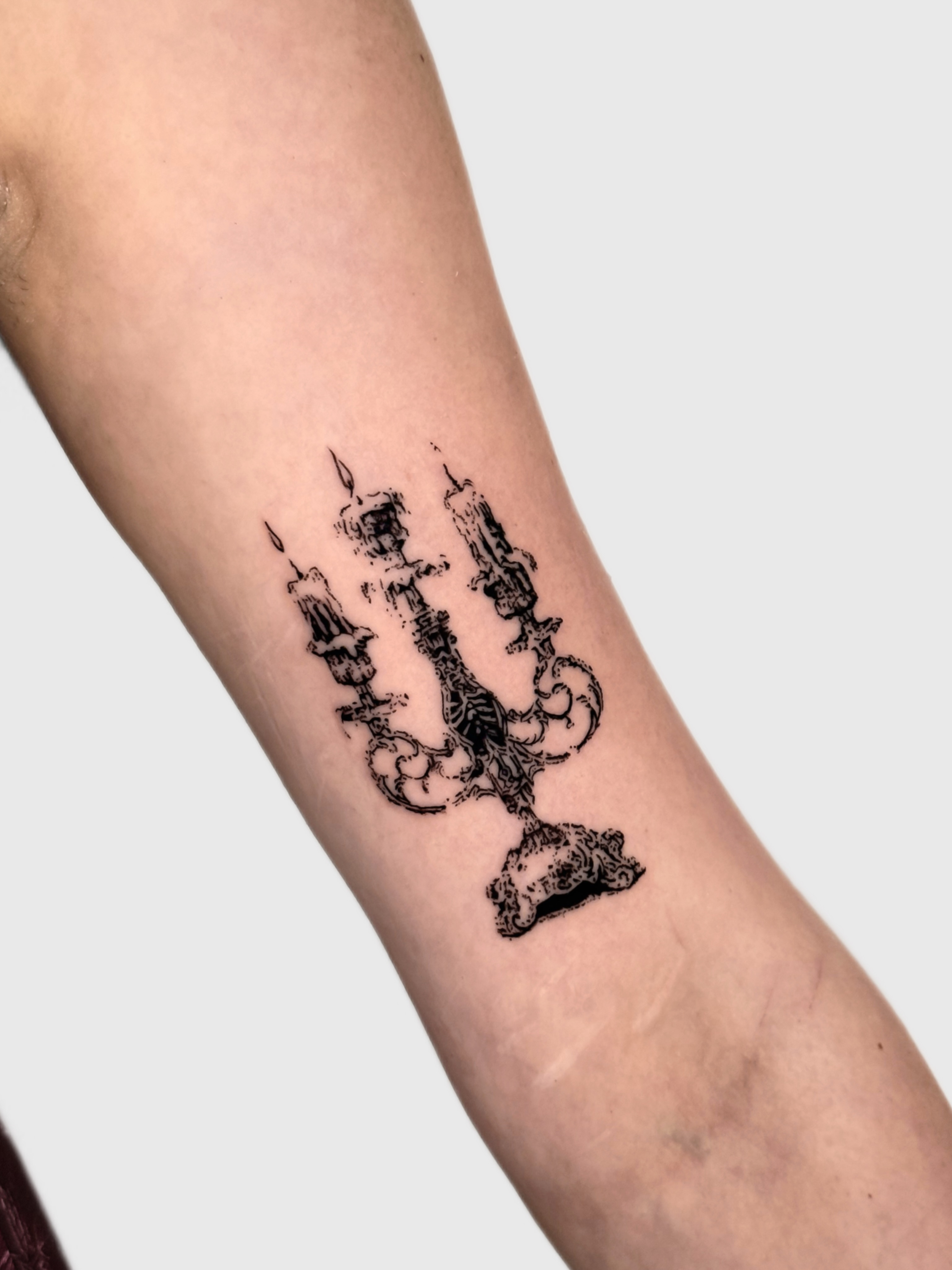 Candelabra black and grey tattoo on the forearm by Miami Tattoo Artist, Miami, Florida