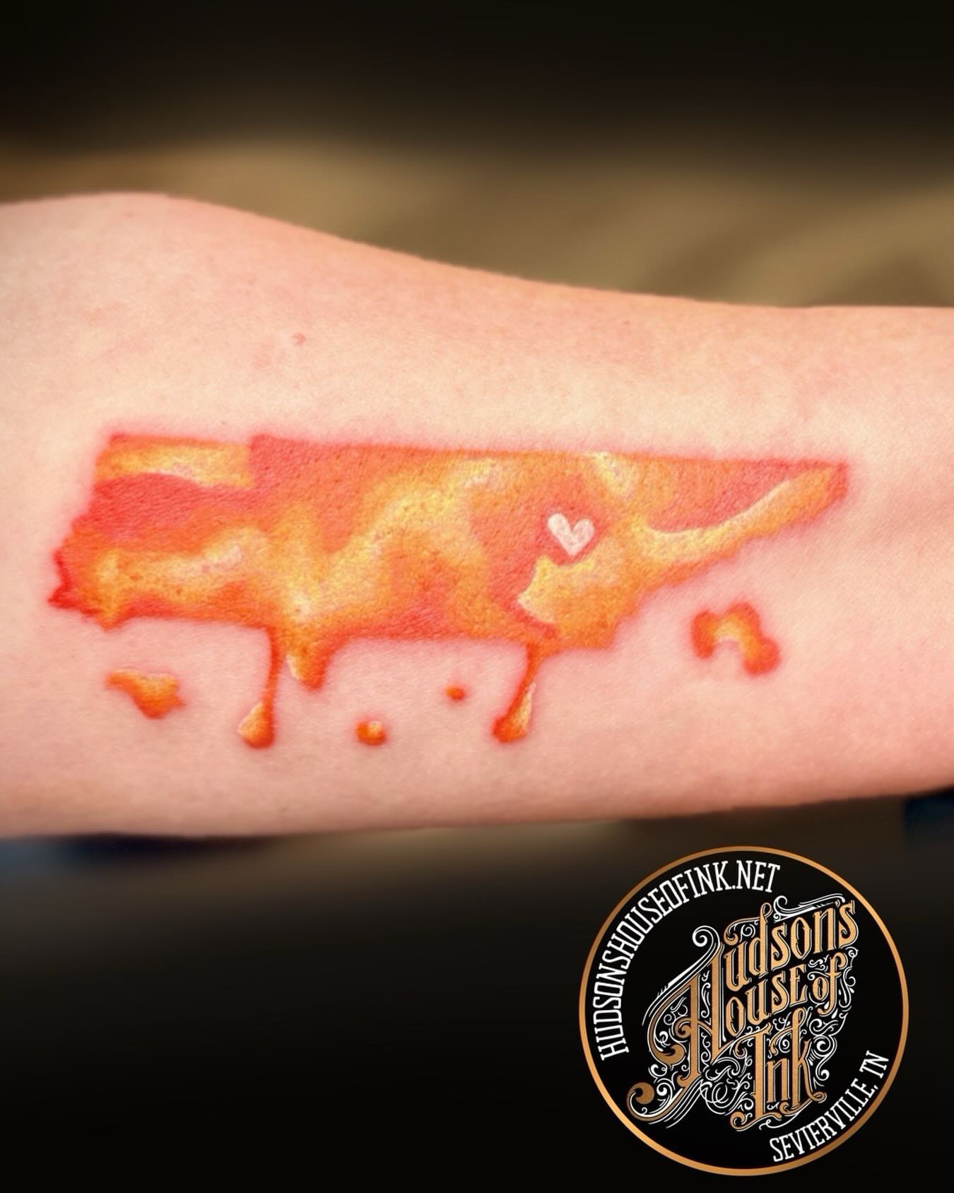 Map watercolor tattoo on the forearm by Kacy Blalock