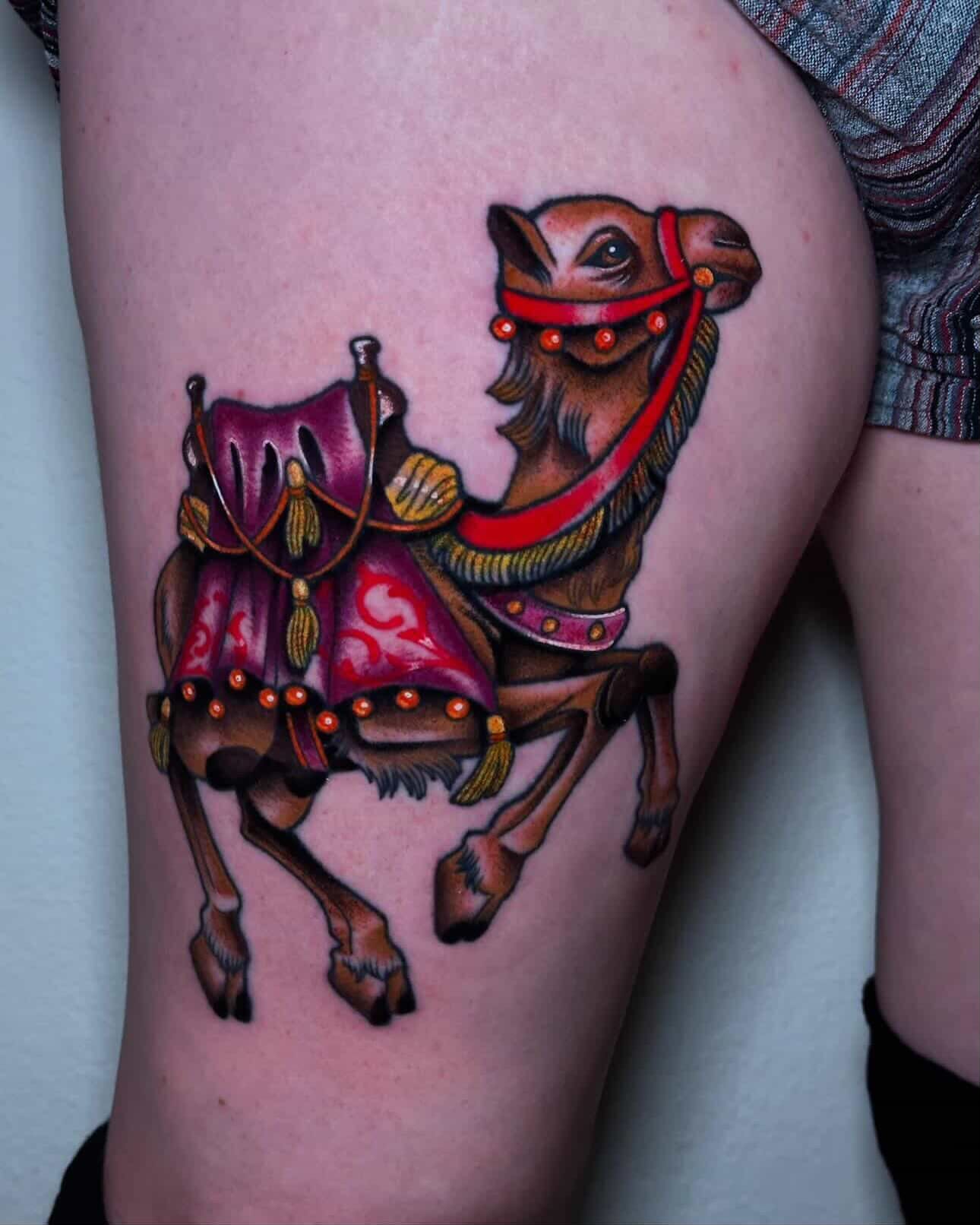 Camel realism tattoo on the thigh by Liz McDonald