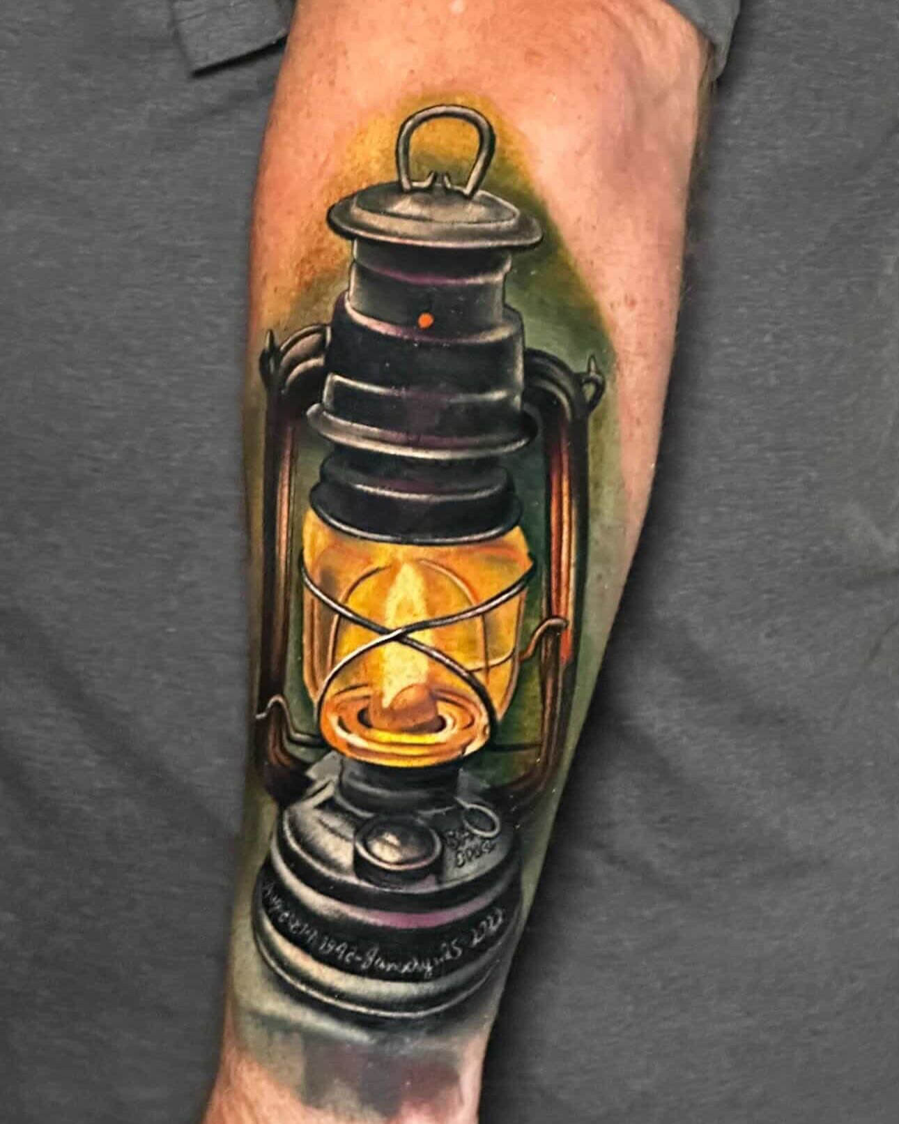 Oil lantern realism tattoo on the forearm by Liz McDonald