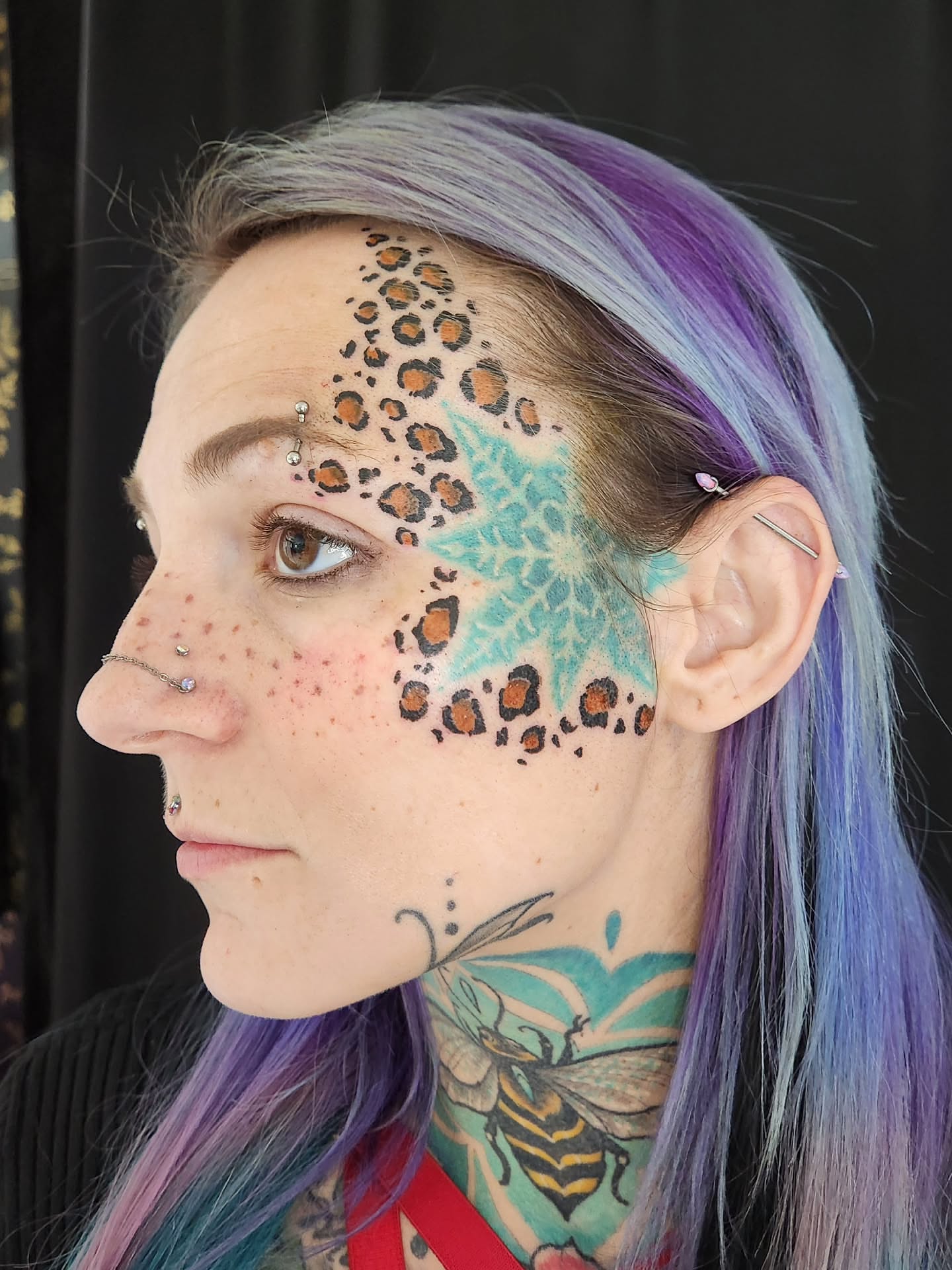 Cheetah print and starburst dotwork tattoo by Randy