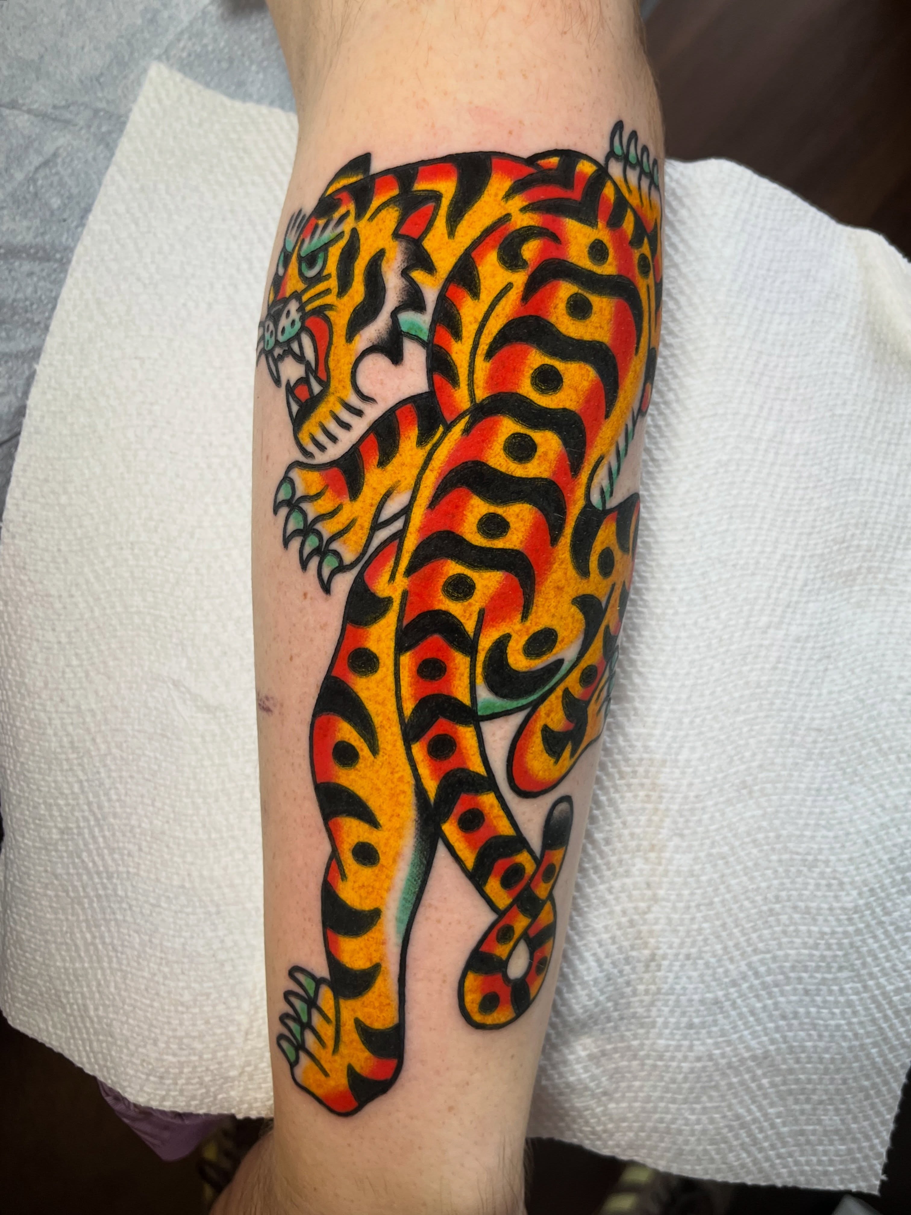 Jaguar American traditional tattoo on the forearm by Traditional Tattooing