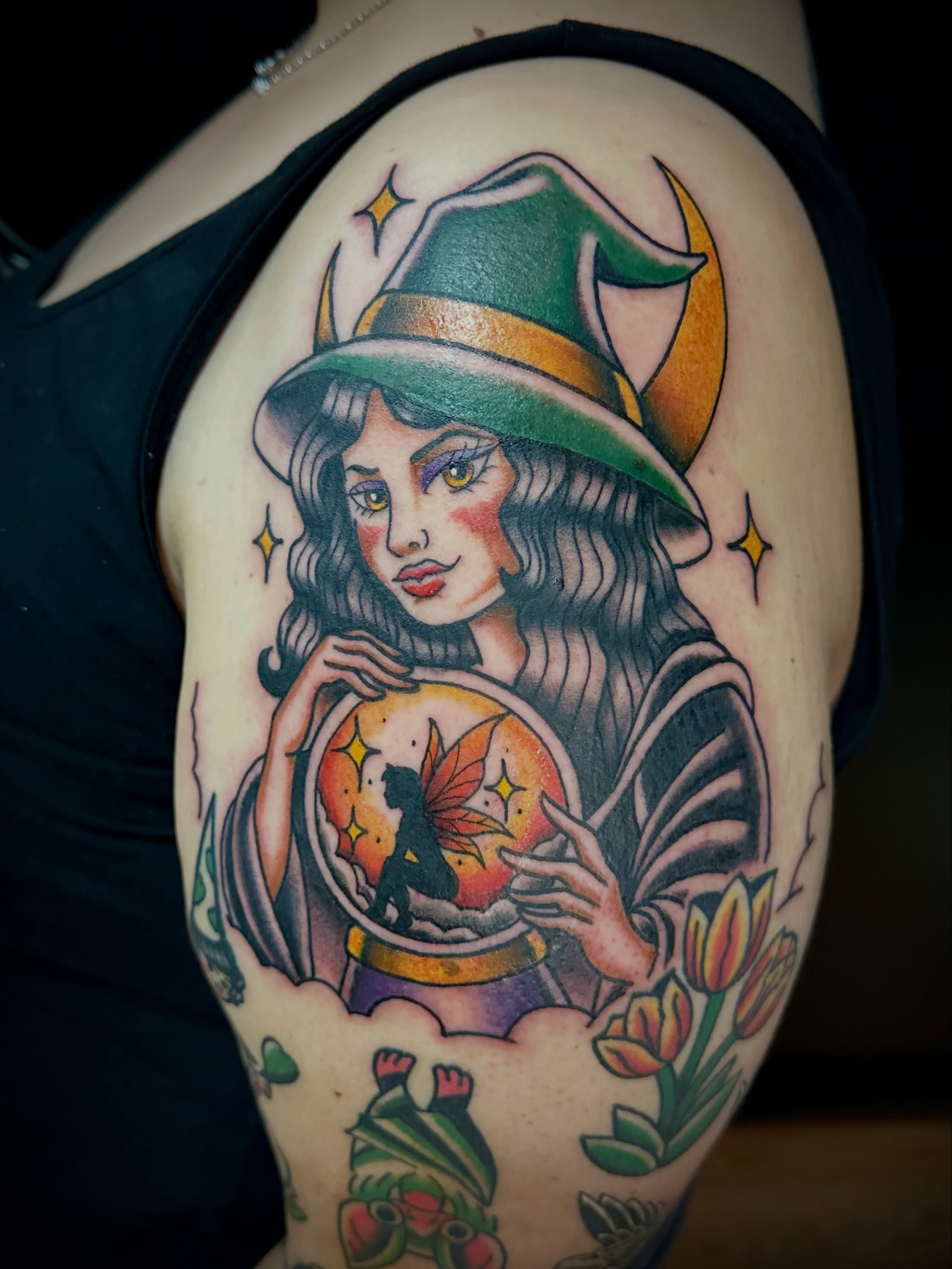 Witch with crystal ball American traditional tattoo on the shoulder by Josh Robinson