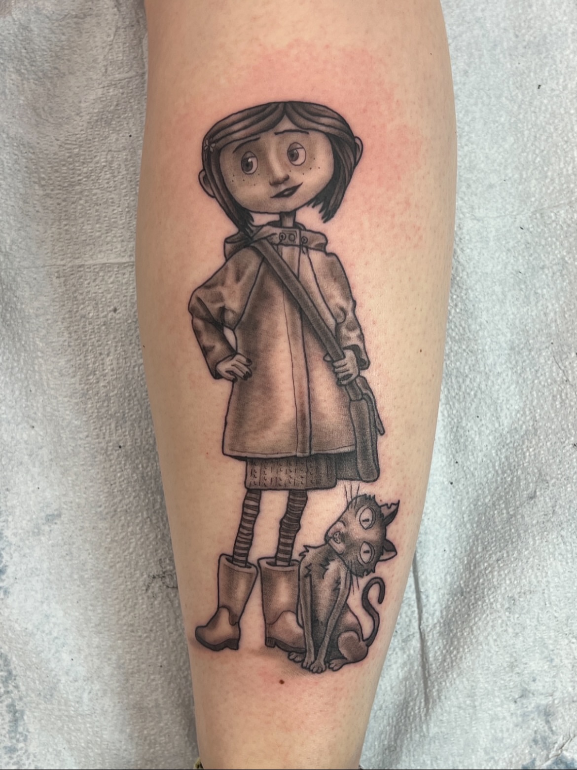 Girl with cat black and grey tattoo on the forearm by ๐๐ฒ๐ต๐ ๐๐ช๐พ๐ป๐ฒ๐ต๐ช ๐ฃ๐ช๐ฝ๐ฝ๐ธ๐ธ๐ผ