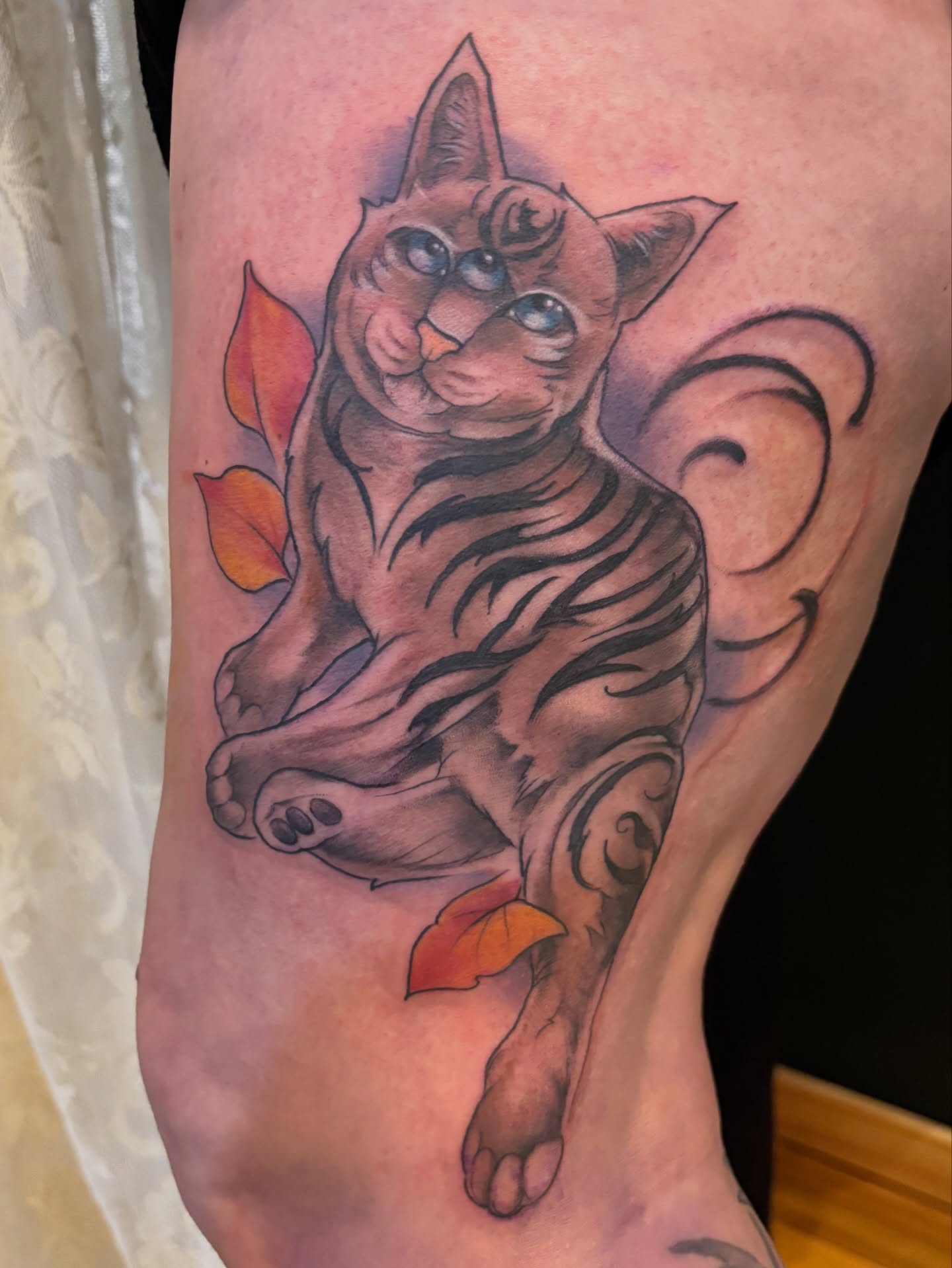 Cat realism tattoo on the thigh by Komfort Kristy