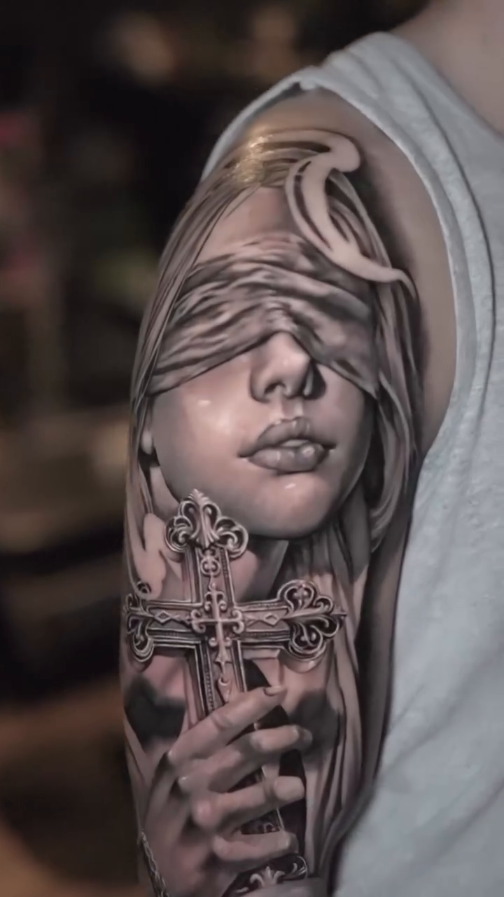 Lady Justice tattoo Chicano tattoo on the upper arm by Bailey Hancock