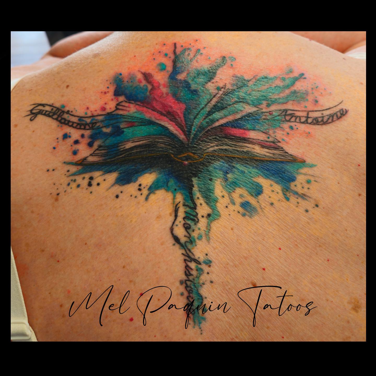 Watercolor butterfly watercolor tattoo on the back by Mel Paquin