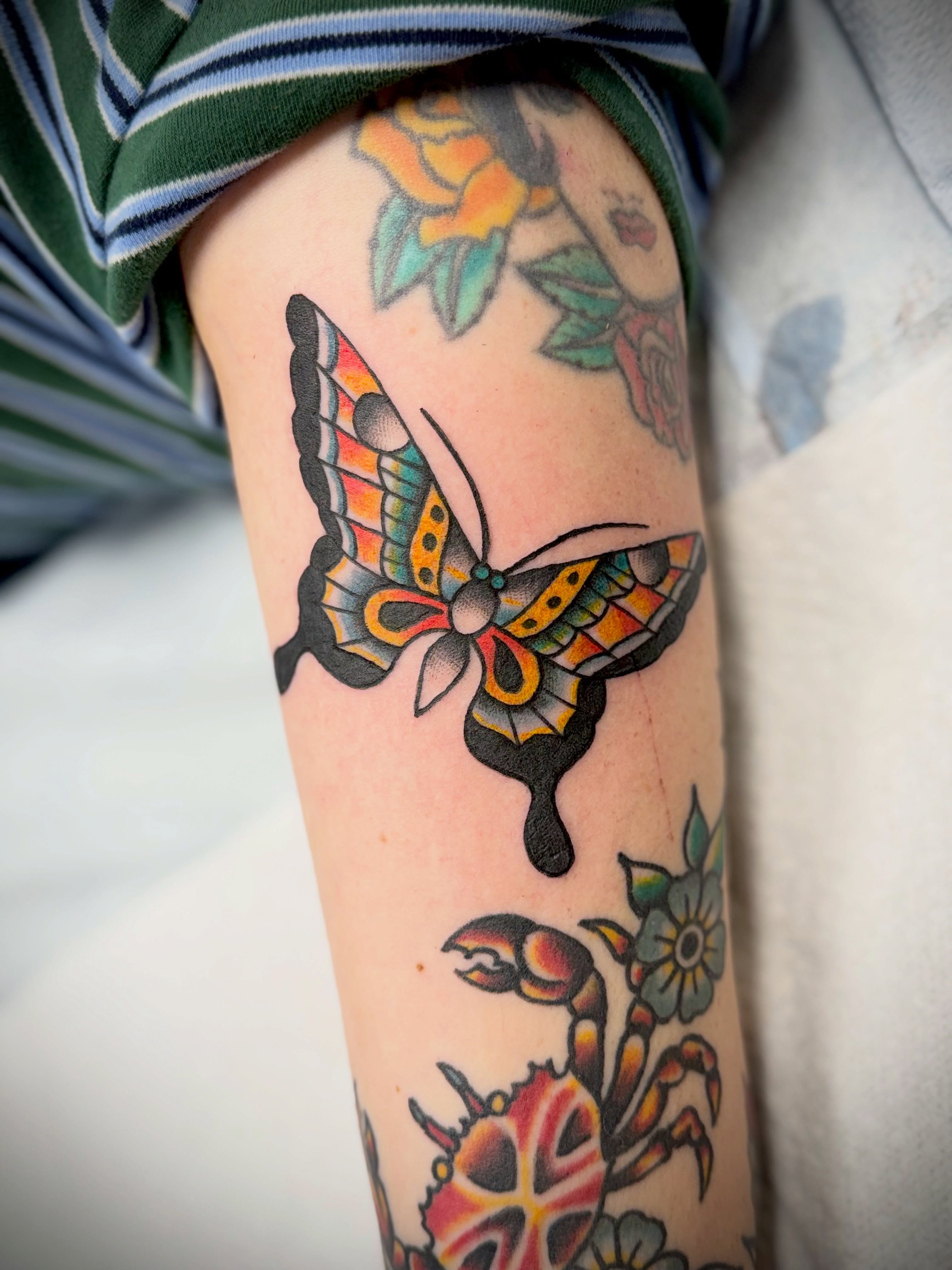 Butterfly American traditional tattoo on the forearm by Shannon Pagliarini