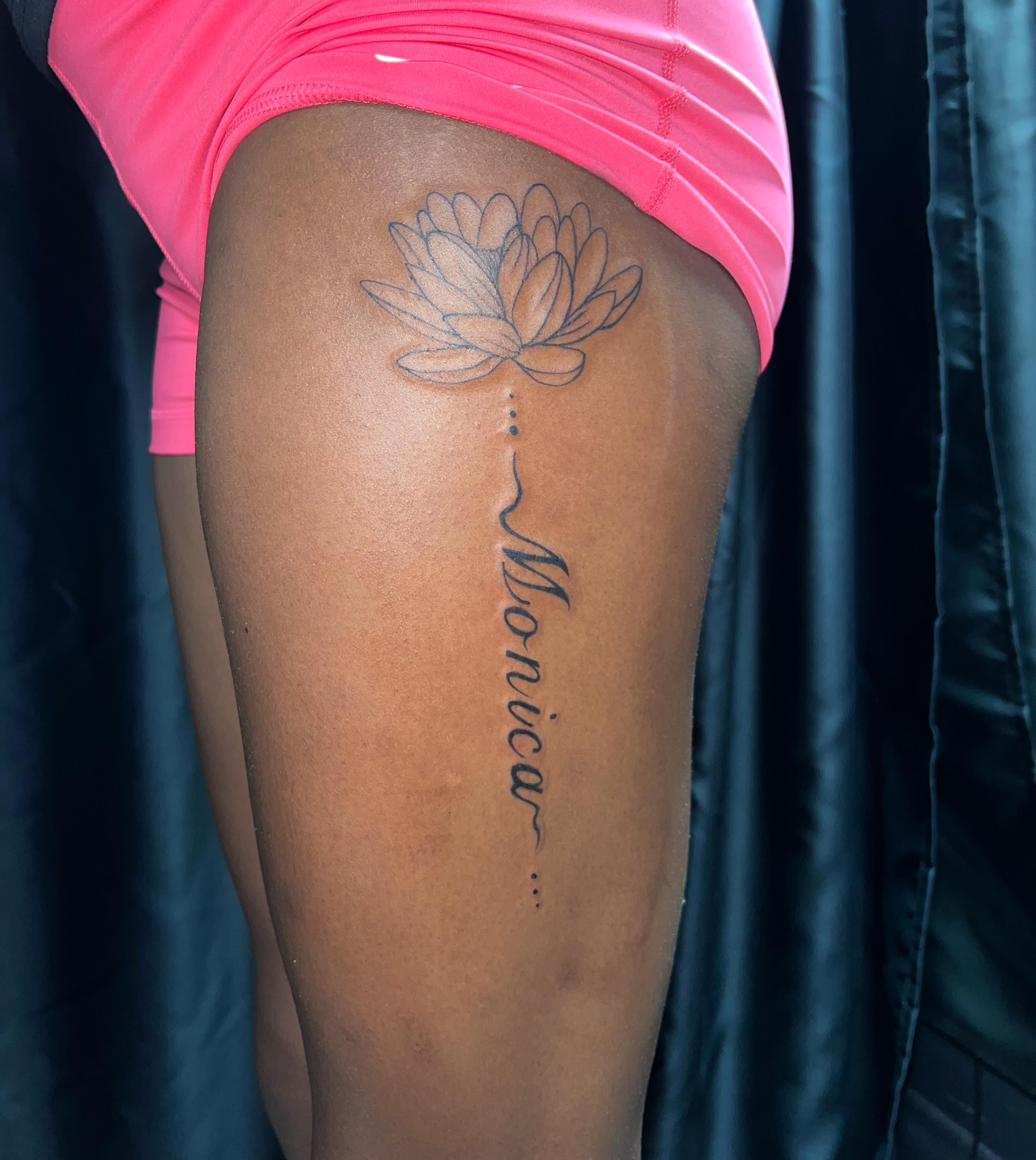 Lotus flower fine line tattoo on the thigh by Haiiitattoo