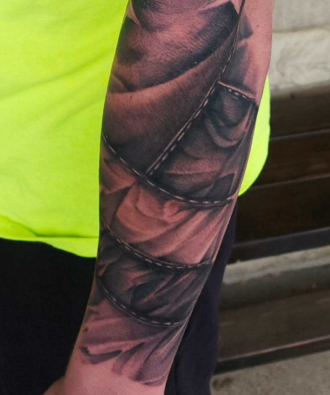 Fabric texture realism tattoo on the forearm by Chris Wodarski