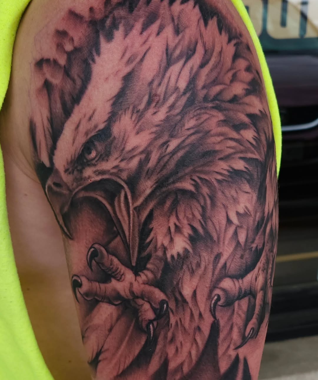 Eagle head and talons realism tattoo on the forearm by Chris Wodarski