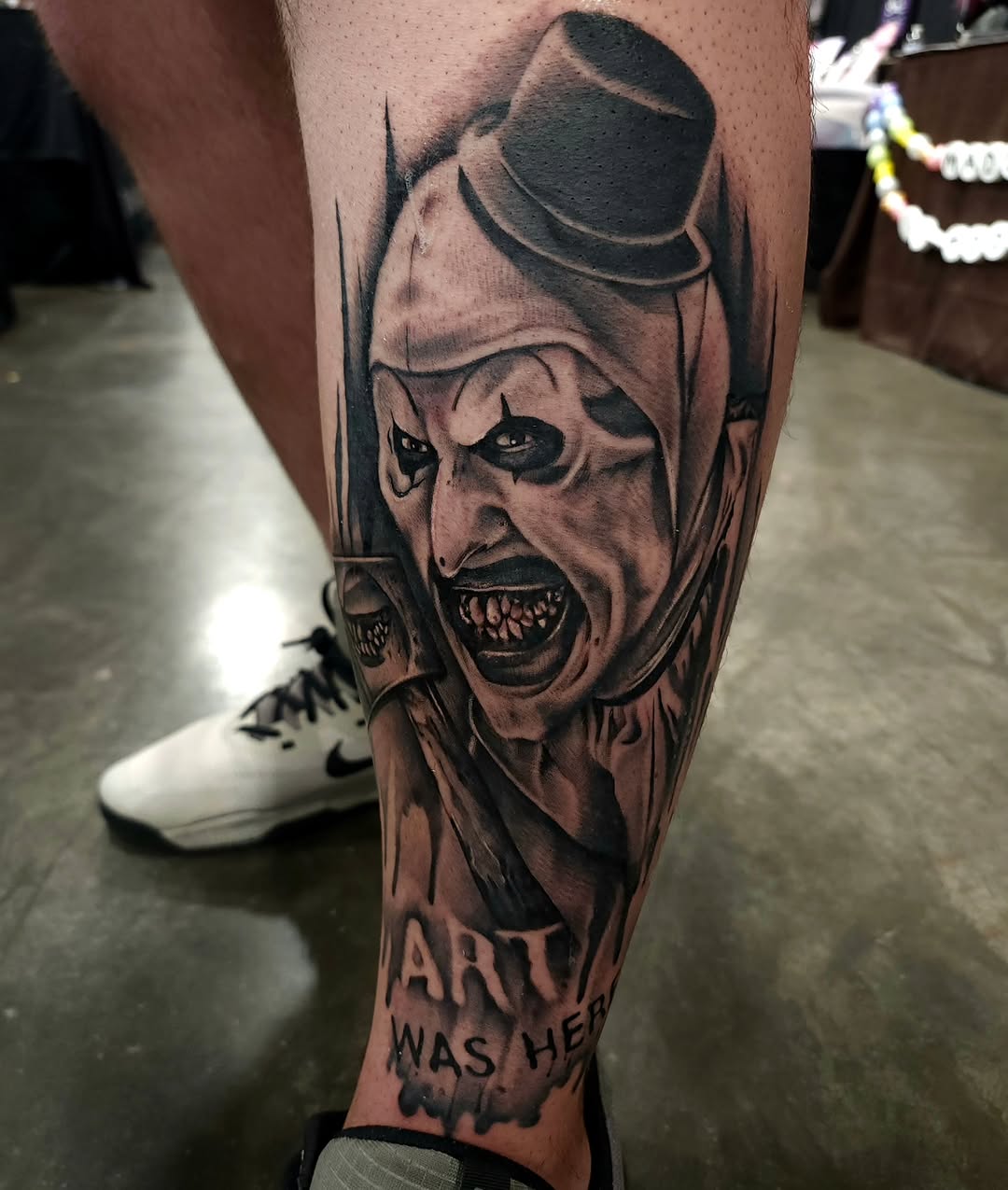 Art the Clown realism tattoo on the forearm by Chris Wodarski