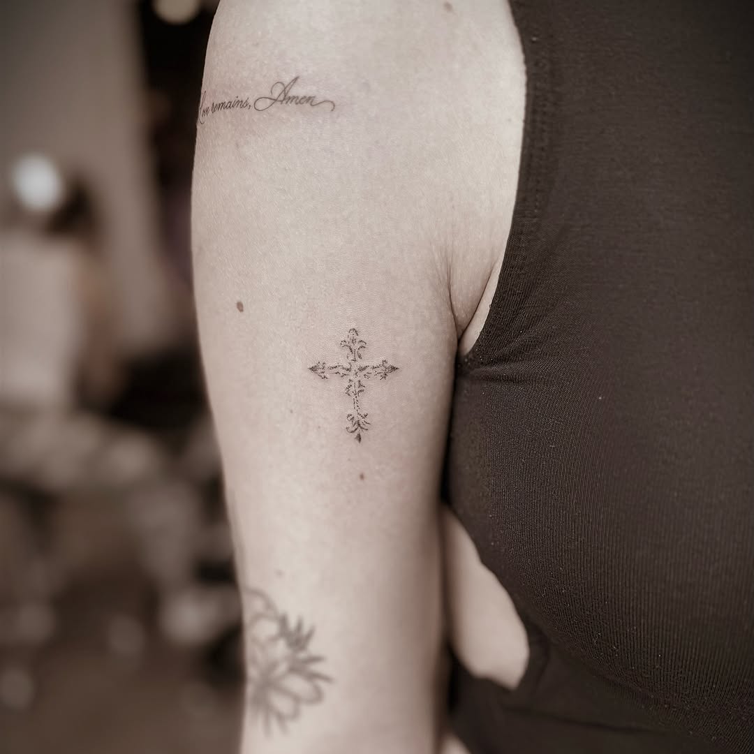 Cross fine line tattoo on the forearm by Chanel Picquelle, Nashville, Tennessee