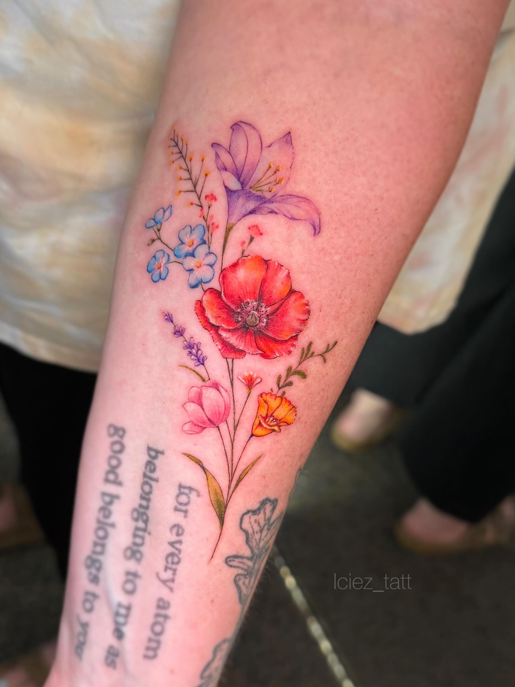 Floral arrangement watercolor tattoo on the forearm by Iciez